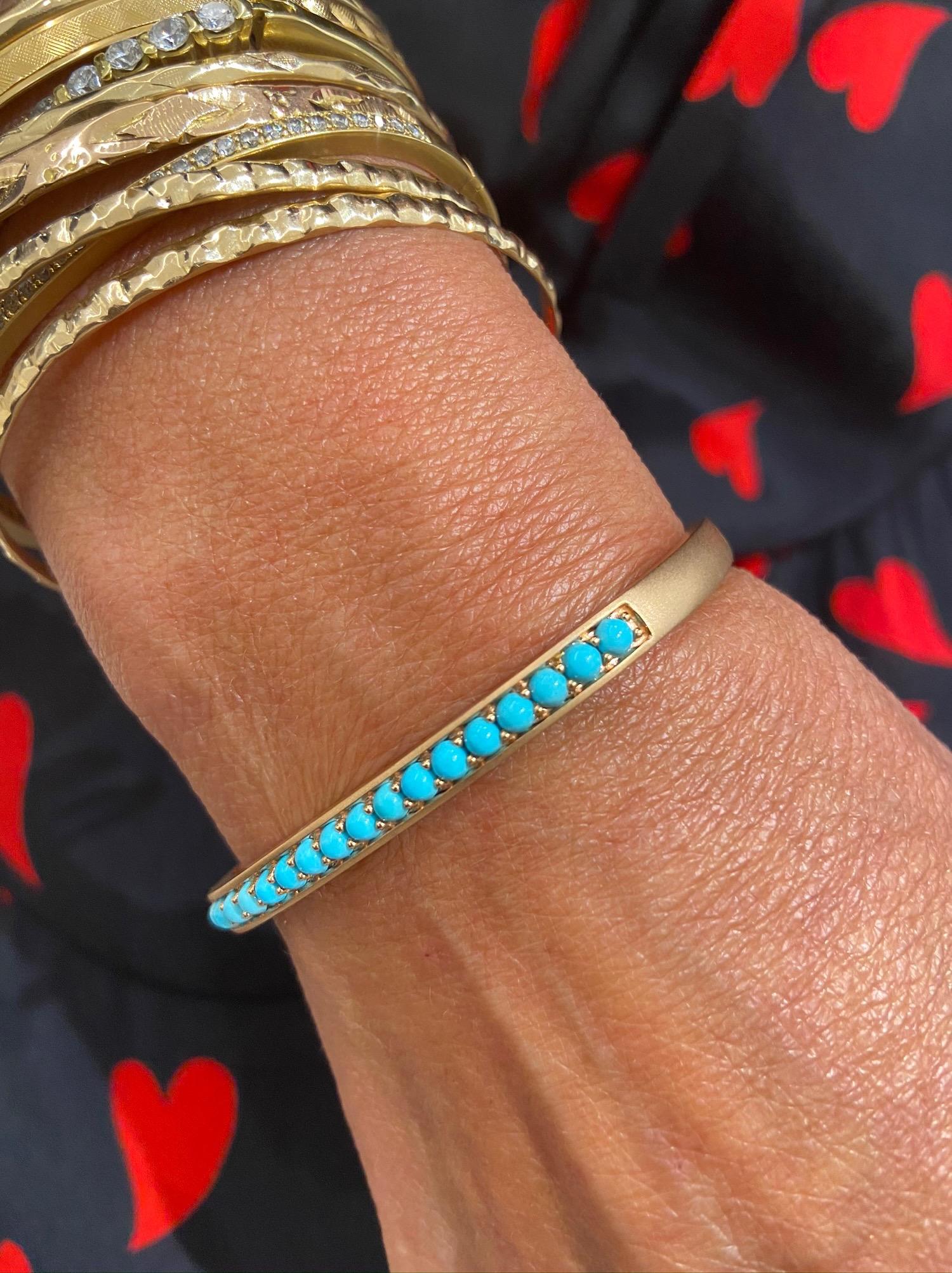 Jane Taylor Jewelry is a family run company focused on creating modern heirlooms since 1994.
This 18 karat rose gold cuff bracelet has a squarish shape and a matte finish. It is set across the top with 17 5mm cabochon Turquoise stones. The bracelet