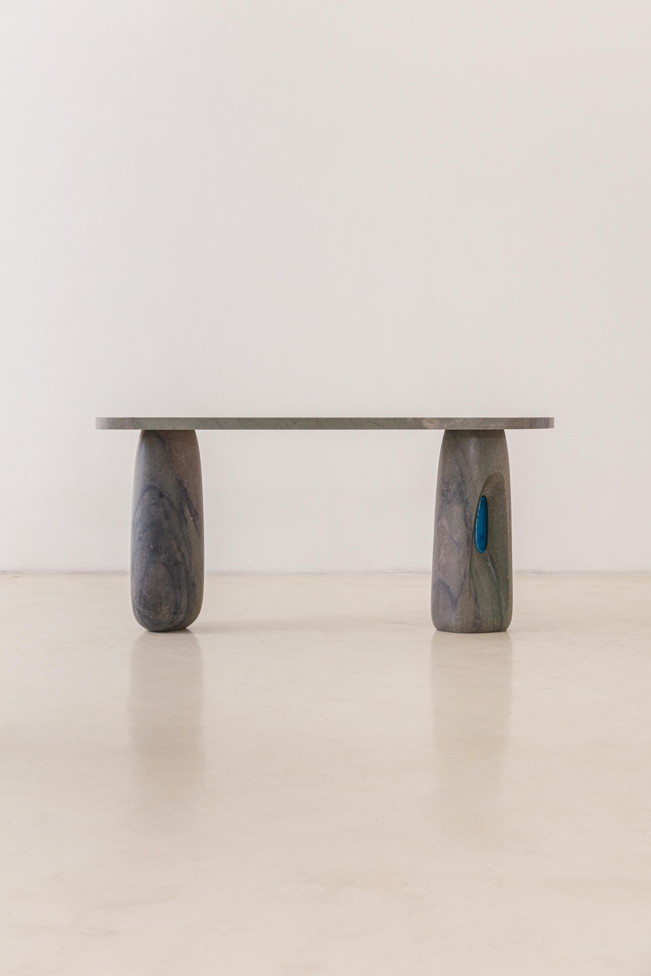 Janela's collection features sideboards, coffee tables, and dining tables sculpted from solid, rare Brazilian quartzites, complemented by glass inserts. Each piece is made to order, and the collection offers customization options for both the stone