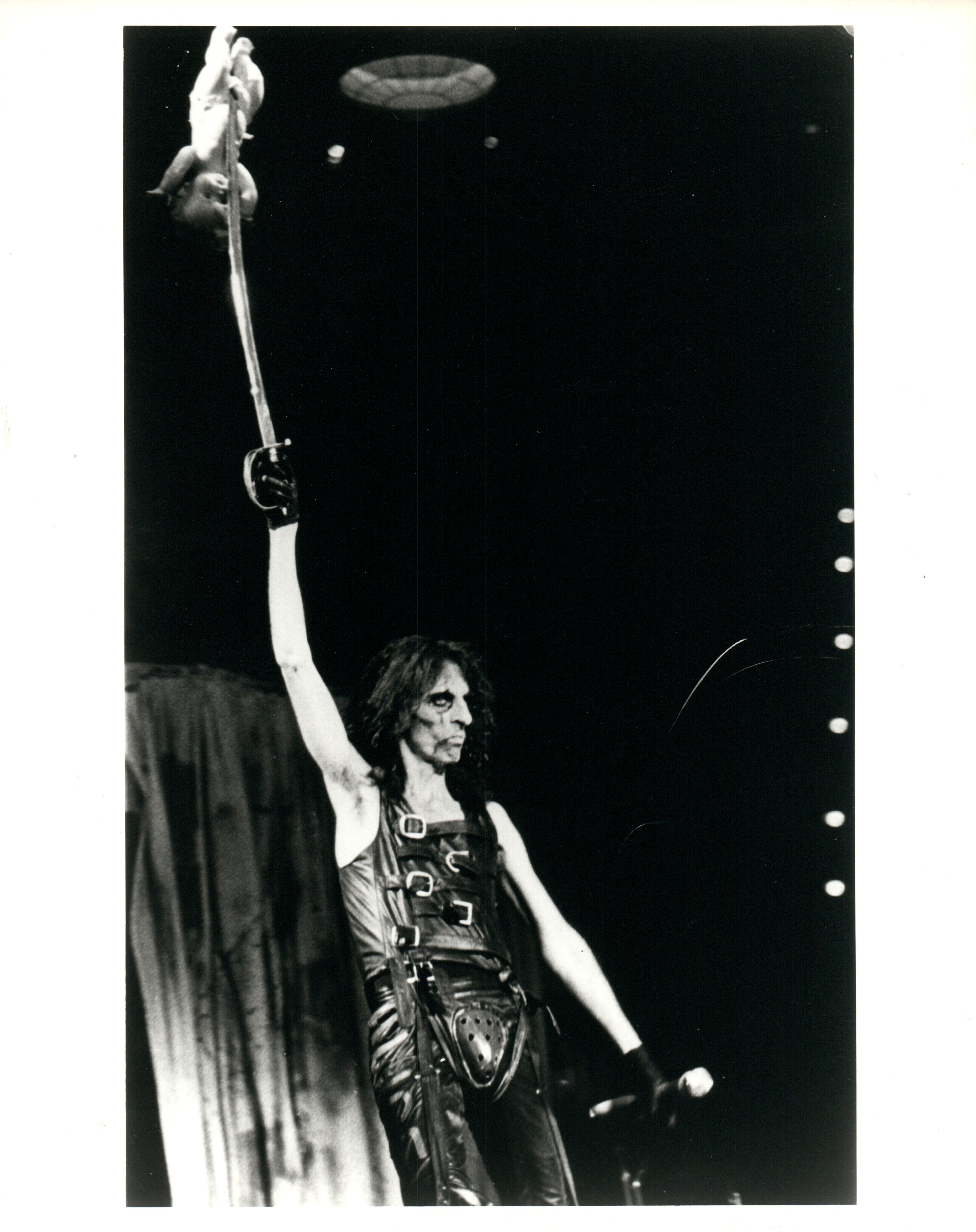Janet Macoska Portrait Photograph - Alice Cooper on Stage with Sword Vintage Original Photograph