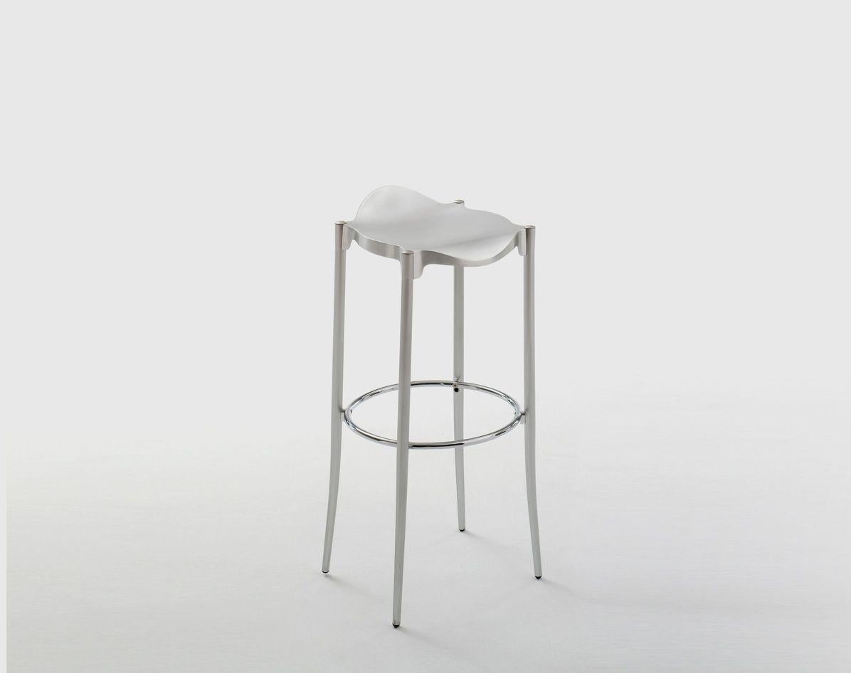 Janet stool by Ramon Ubeda & Otto Canalda
Dimensions: Diameter 38 x Height 65 cm 
Materials: Tubular chromed steel structure. Seat in a bright polished cast aluminum AG3 and anodized silver. Also available in an upholstered black leather