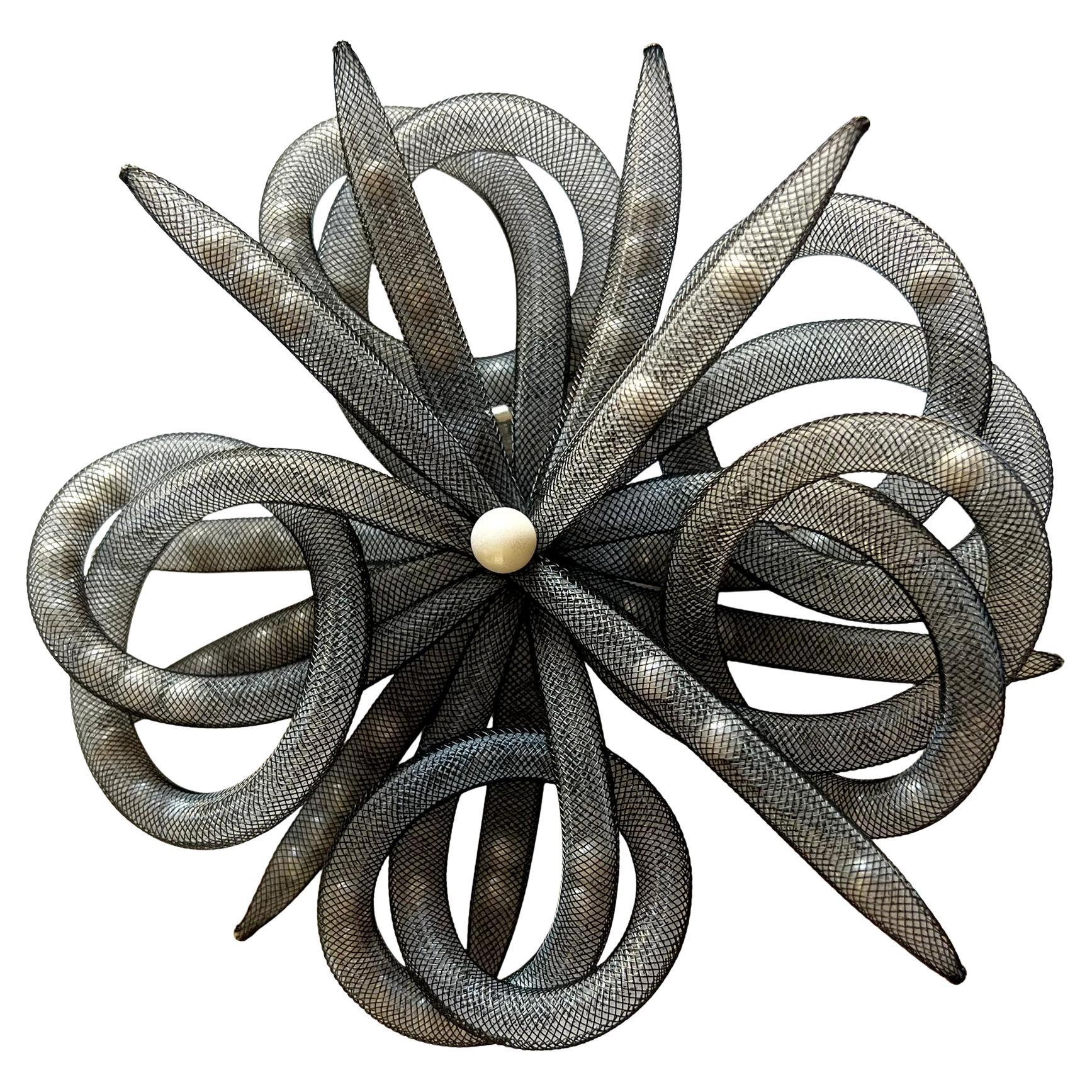 De Farro mesh and pearl brooch by Italian-Brazilian jewelry designer, Janete Zamboni. Loose pearls trapped within a metal mesh net, are a continuing theme of Zamboni's work.  Brooch measures 5.75