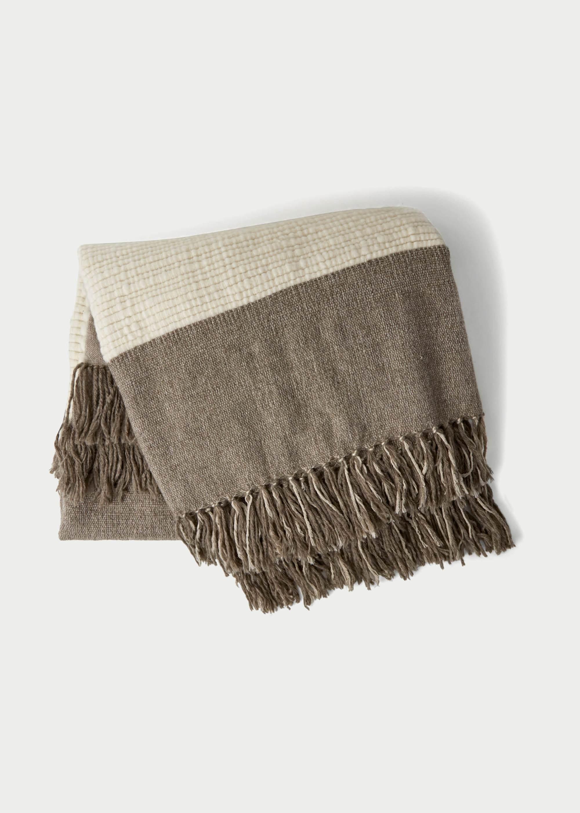 Nepal’s untamed landscapes and rugged nature are at the heart of the inspiration behind our Ja?gali Blanket. Like the wild mountain ranges of the Himalayas, Ja?gali weaves together a contrasting collection of adventurous textures to create a