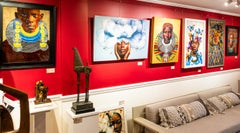 "Tribal Visions" African person wearing yellow earrings and rope necklaces