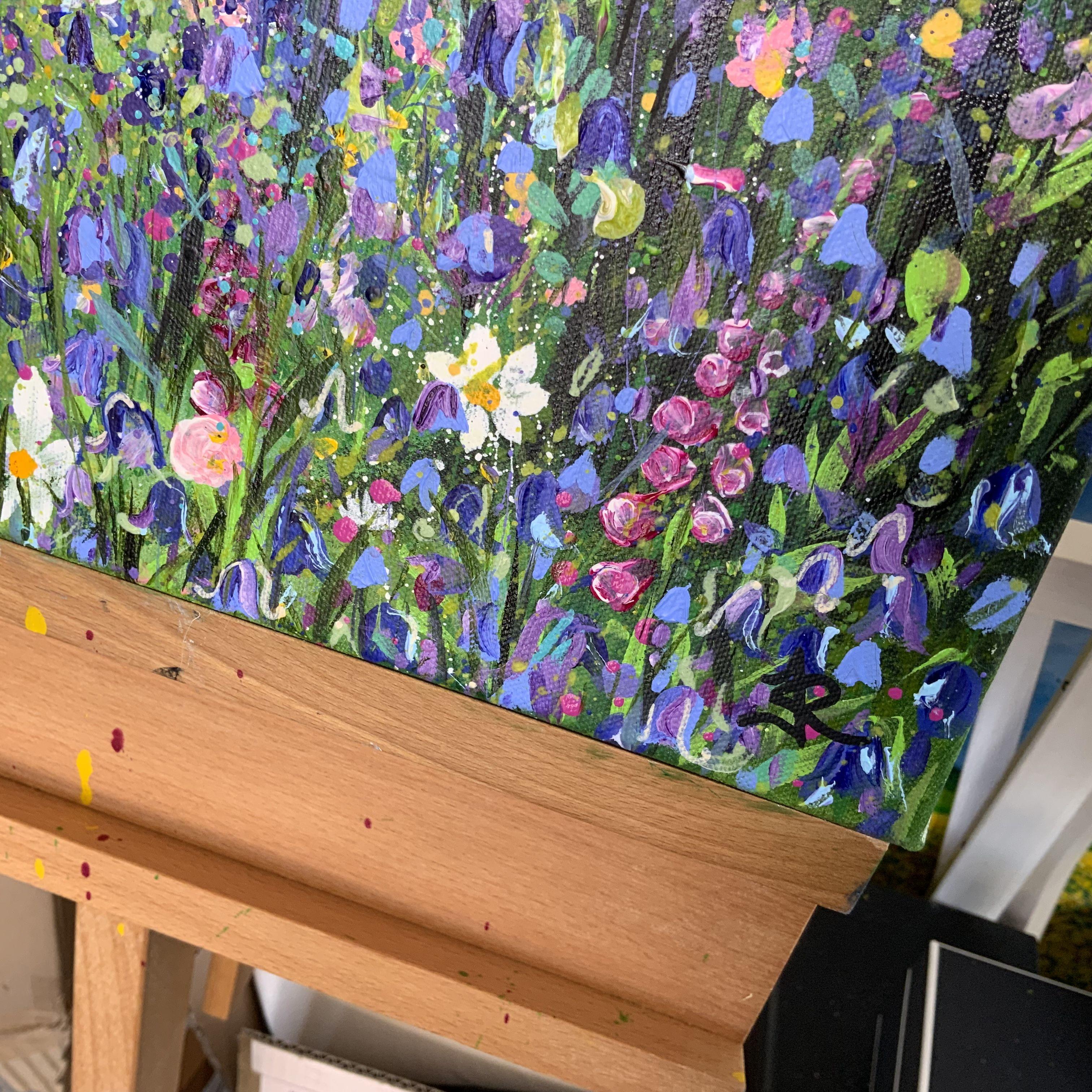 A colourful woodland retreat, a hideaway, a place of calm and tranquility. Sky blues fade to lush greens, sun shines through lighting a distant field. In the foreground wild flora sit together with Bluebells  creating a rainbow carpet. Inspired by
