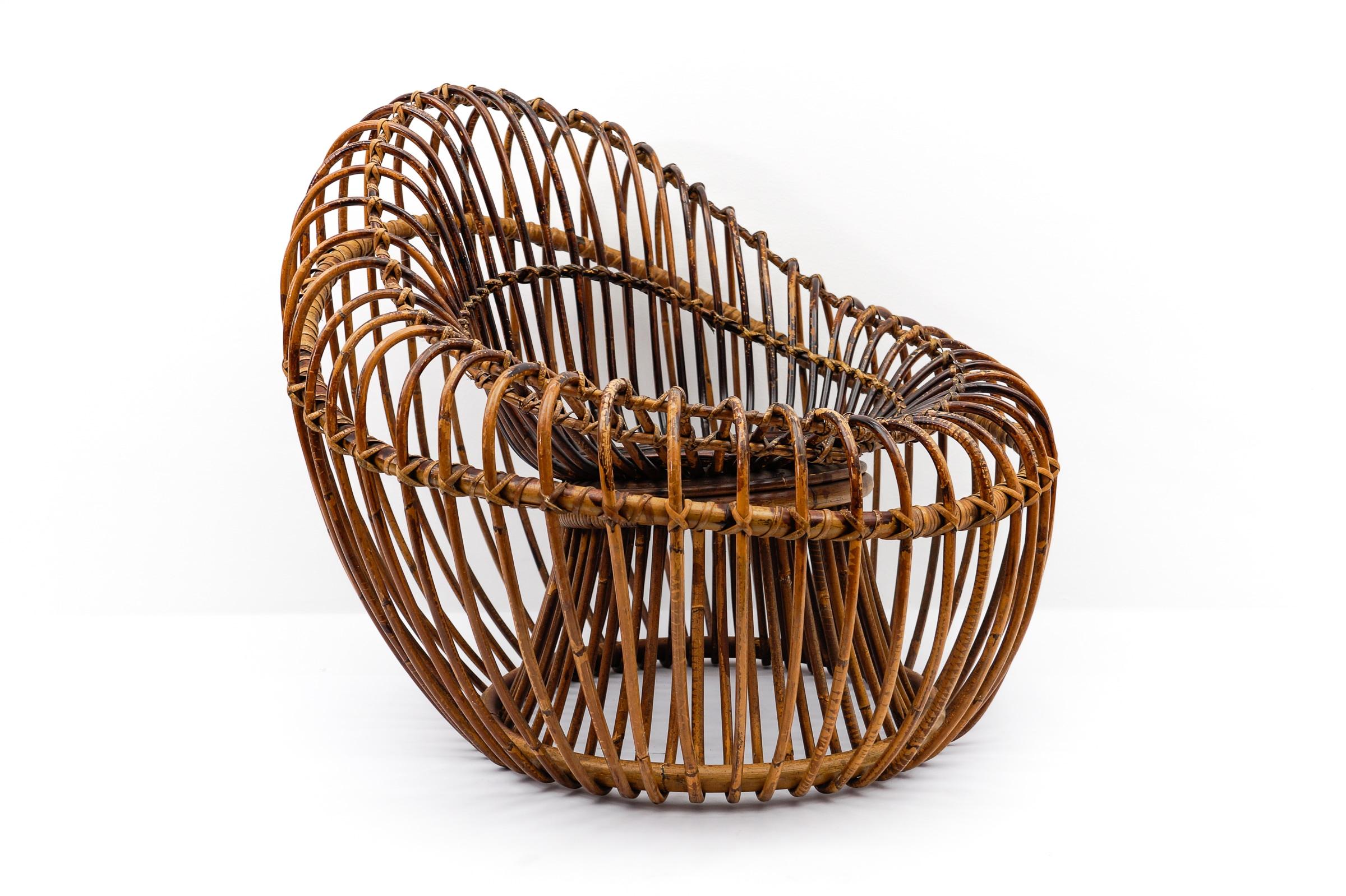 Very rare chair made of bamboo and wicker, designed in 1956 by French-Dutch couple Janine Abraham and Dirk Jan Rol.

The famous couple won several awards, including the gold medal at the 1958 Brussels Expo for this special chair. (see last photo)