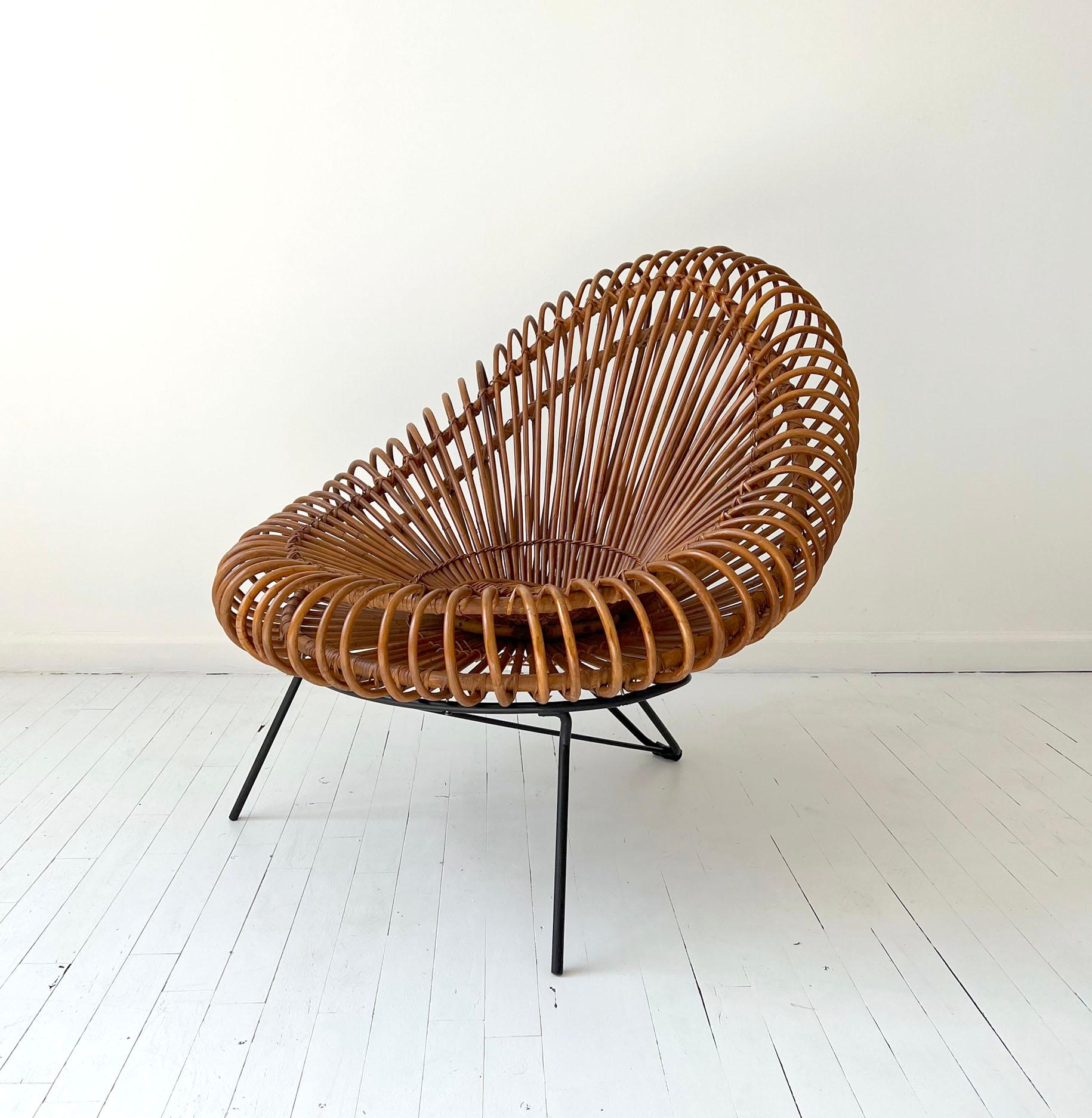 This beautiful woven rattan chair combines Janine Abraham’s imagination with Dirk Jan Rol’s architectural construction skills.

From the circular woven center to the shell of the seat, the craft of the designer and manufacturer is outstanding. The