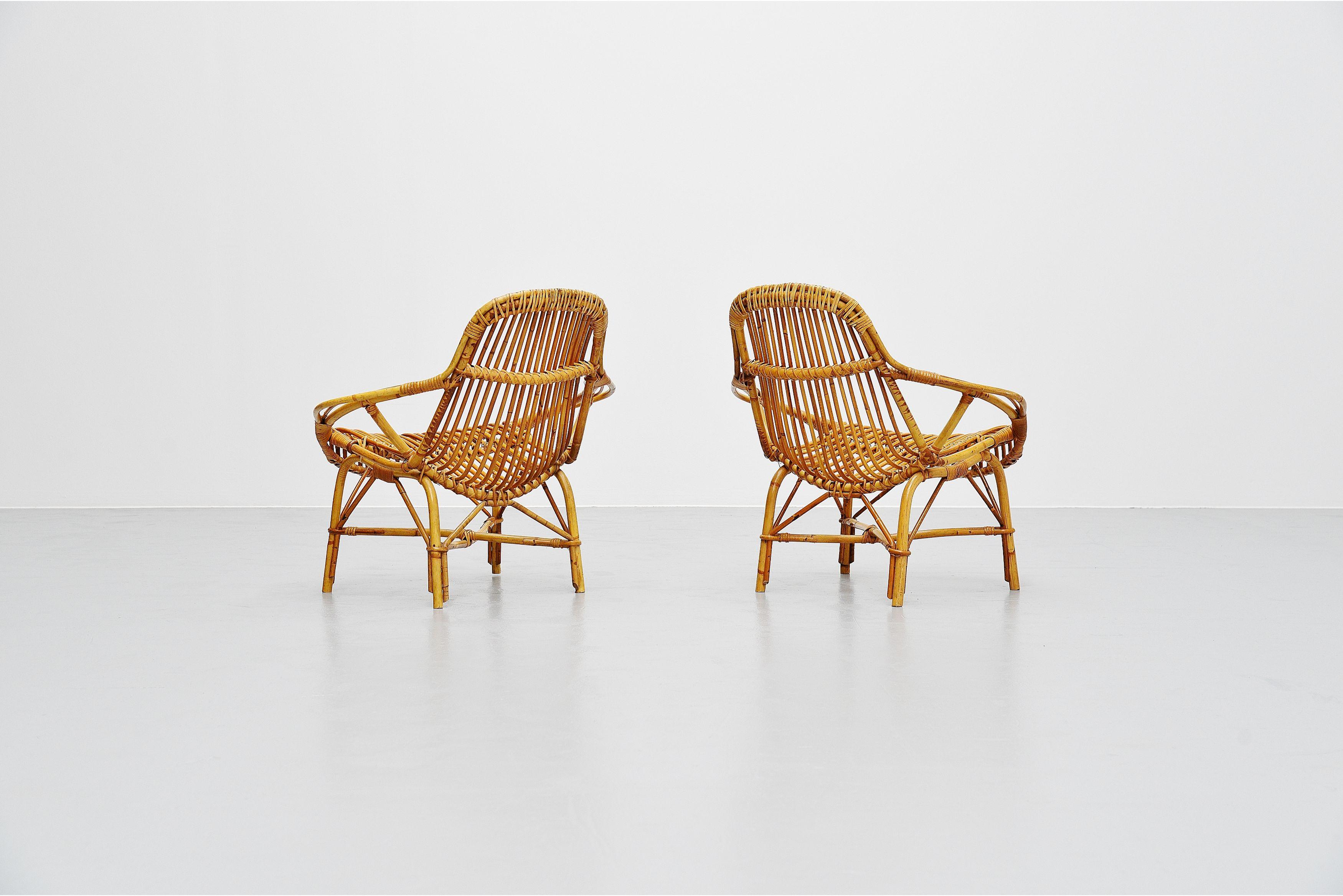 Stunning sculptural shaped Mantis lounge chairs attributed to Janine Abraham and Dirk Jan Rol for Rougier, France, 1950s. These rattan lounge chairs have the shape of a mantis and are very well crafted. Super nice set of sculptural shaped lounge