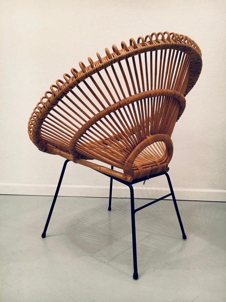 Vintage rattan chair by Janine Abraham and Dirk Jan Rol, France, ca. 1960s
Very good condition except one bamboo stem missing (pictures)
Black iron base, dismountable for shipping.
  