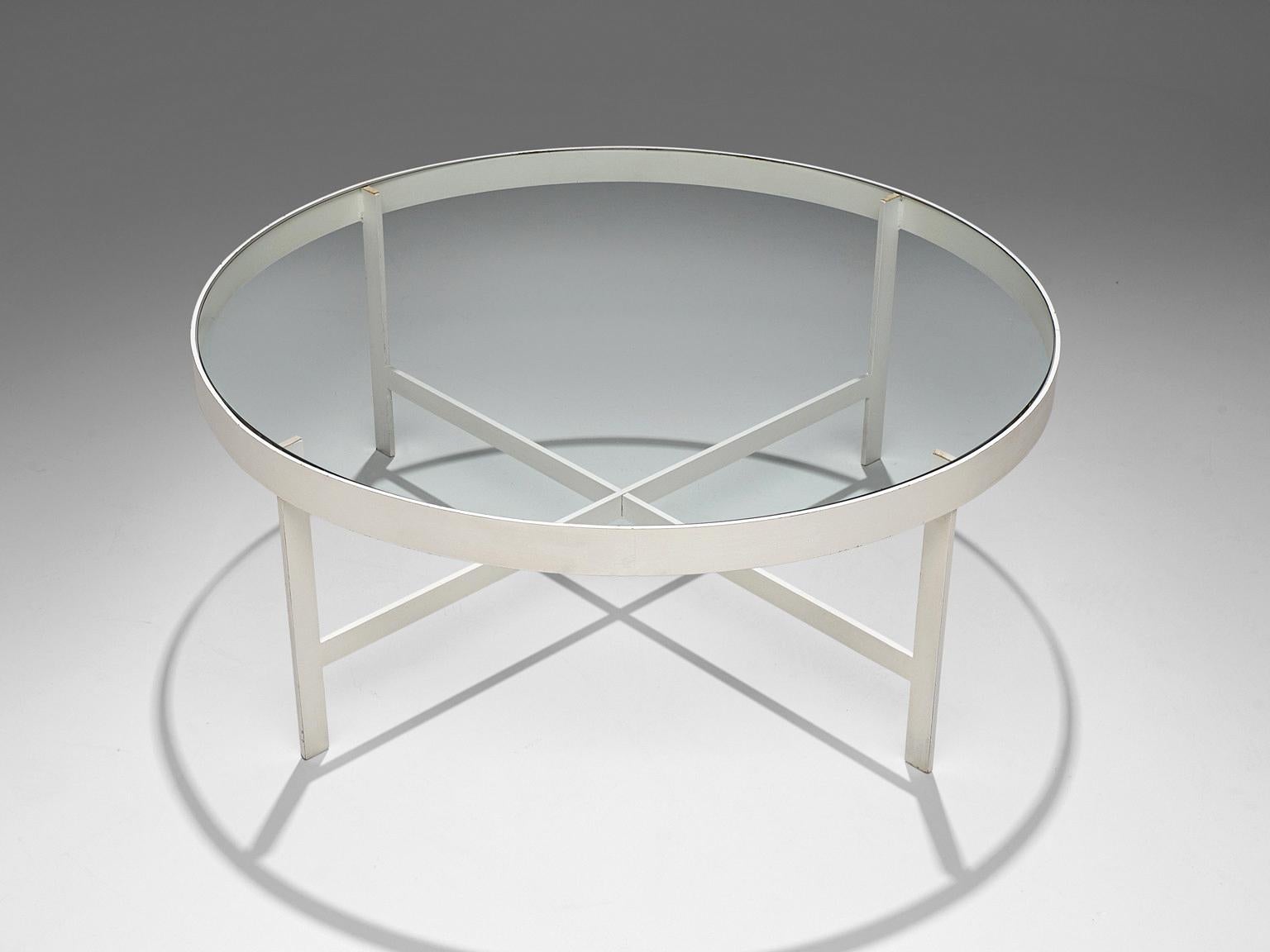 Janni Van Pelt, coffee table, glass, steel, The Netherlands, circa 1958. 

Round coffee table in white coated steel and glass. This table is a variation on Janni Van Pelt's 'G4' model. The base consists of four metal legs with a cross-connection.