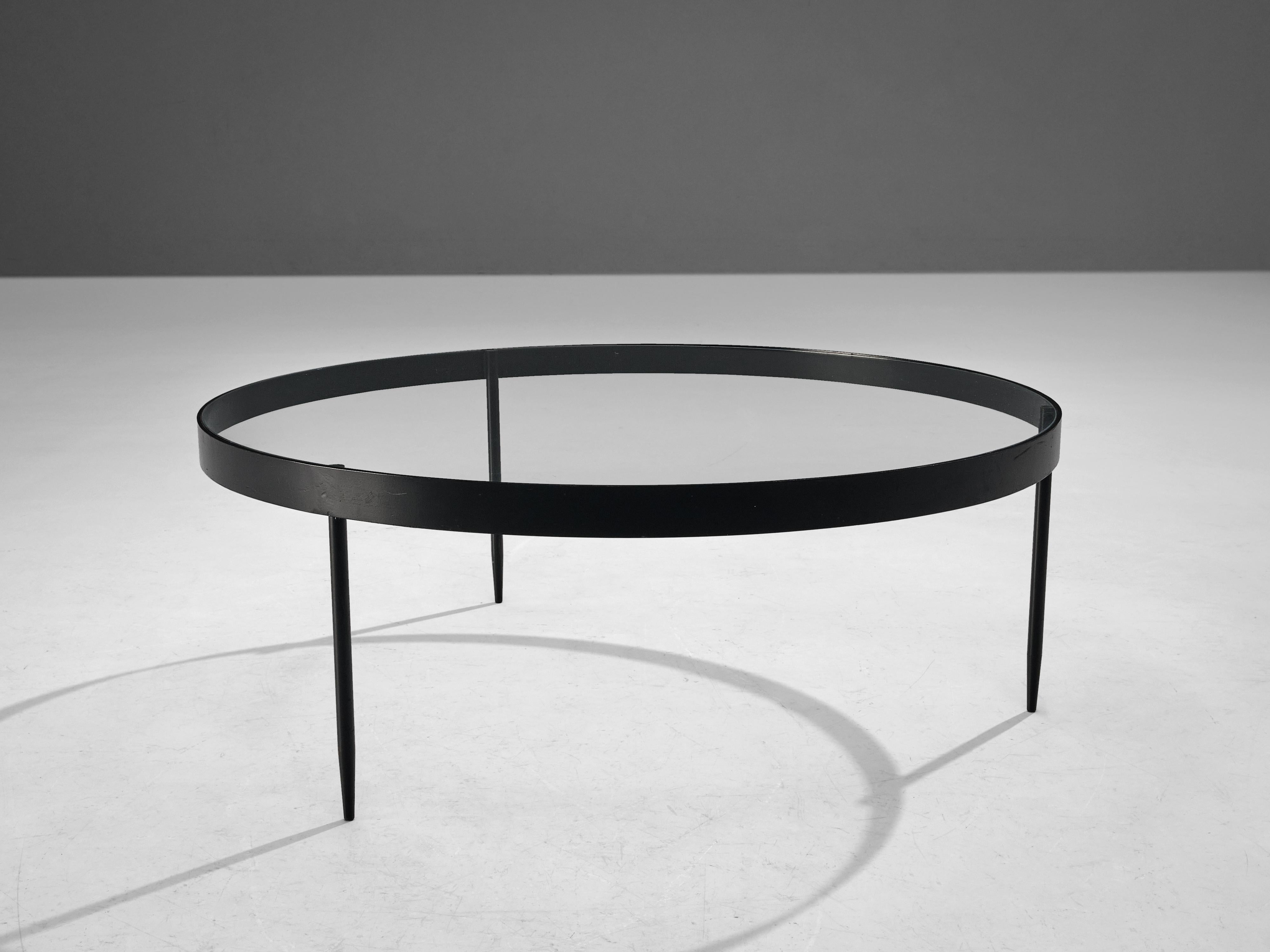 Janni Van Pelt, coffee table, glass and black metal, the Netherlands, circa 1958.

Round coffee table in black coated metal and glass. This table is a variation on Janni Van Pelts model G4. The base consists of four legs with a cross-connection.