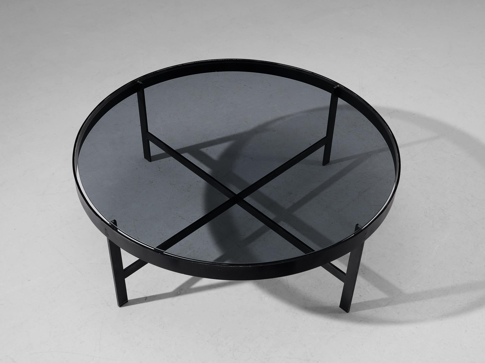 Janni Van Pelt, coffee table, glass and black metal, the Netherlands, circa 1958.

Round coffee table in black coated metal and glass. This table is a variation on Janni Van Pelts model G4. The base consists of four legs with a cross-connection. The