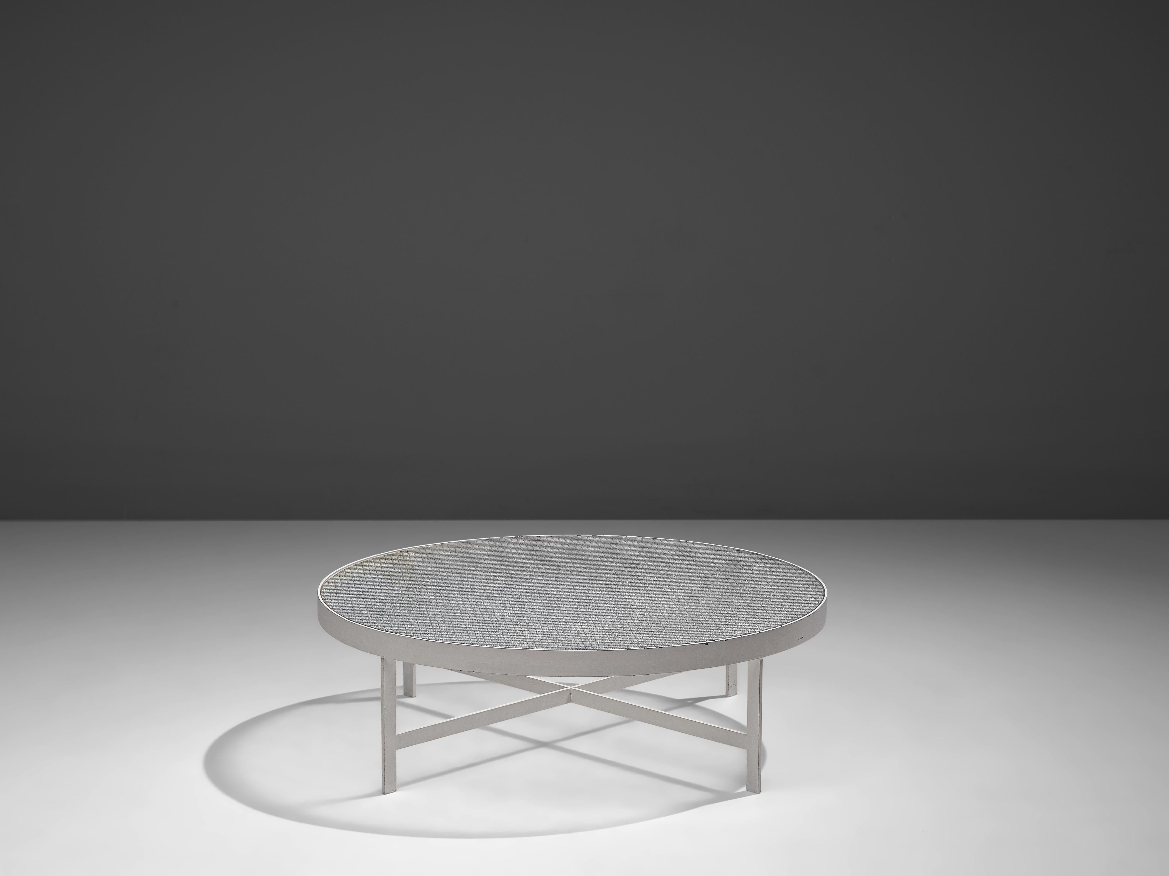 Janni Van Pelt, coffee table, glass, white metal, the Netherlands, circa 1958 

Round coffee table in white coated metal and wired glass. This table is a variation of Janni Van Pelts model M419. The base consists of four flat legs with a
