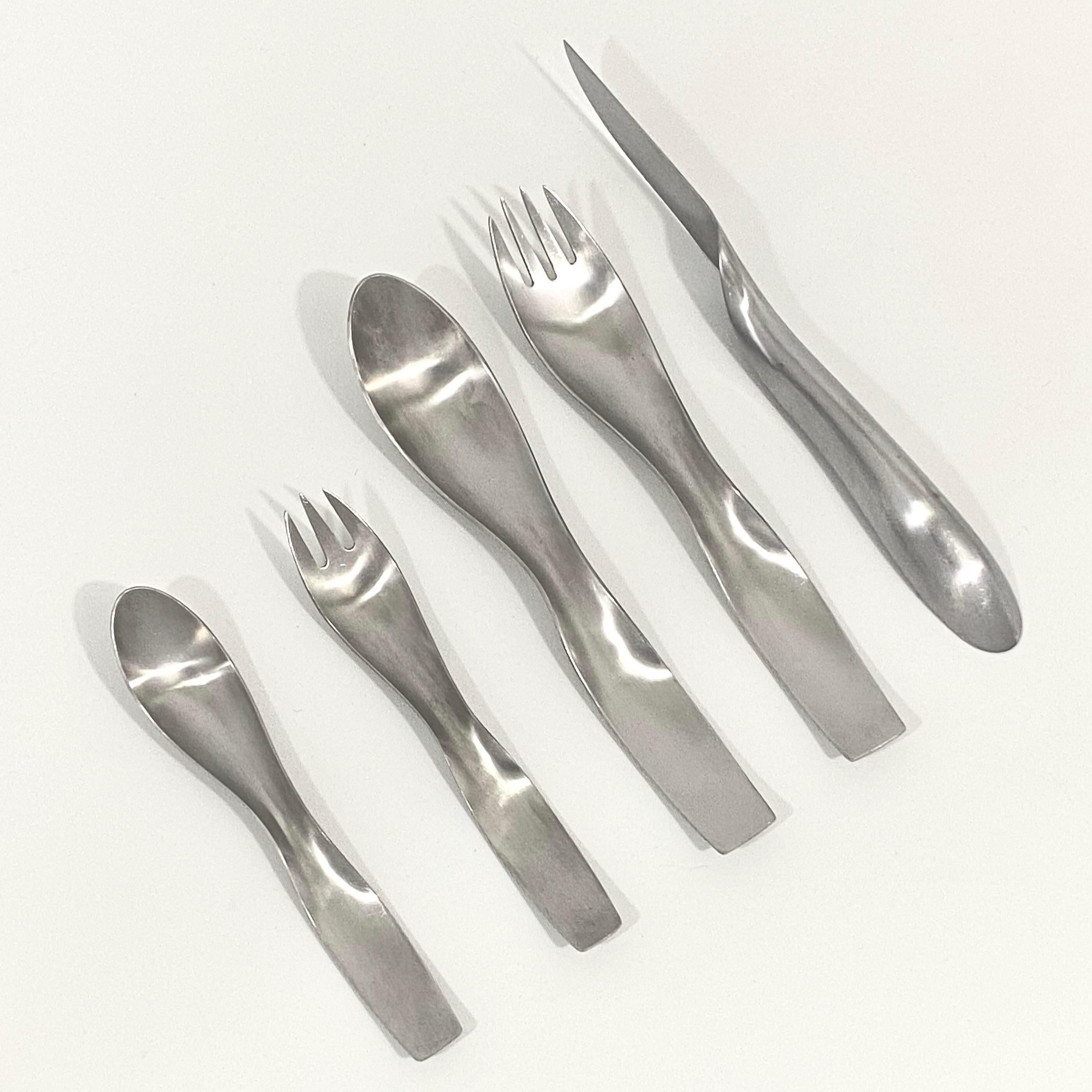 Rare János Megyik for Amboss avant-garde flatware service for 12. Each service includes 5 utensils: dinner fork, salad / dessert fork, dinner / soup spoon, tea spoon and dinner knife. Each utensil is stamped and marked. Great vintage condition with