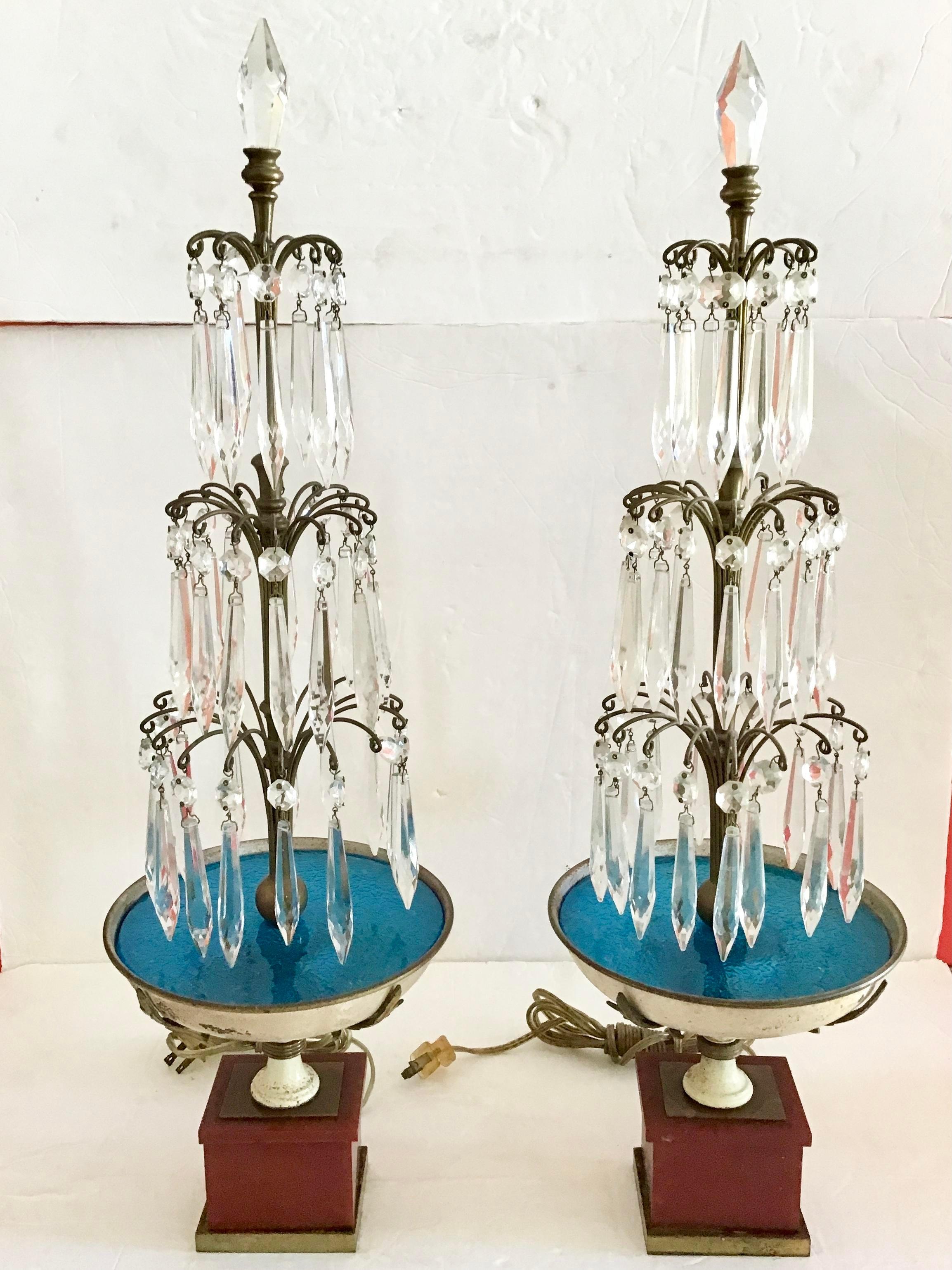 Very elegant pair of Jansen chandelier table lamps with crystals, metal, and turquoise glass. Base is wood pedestal. Great details in their design. Would be a nice addition to your interiors, would look great in a living or dining room.