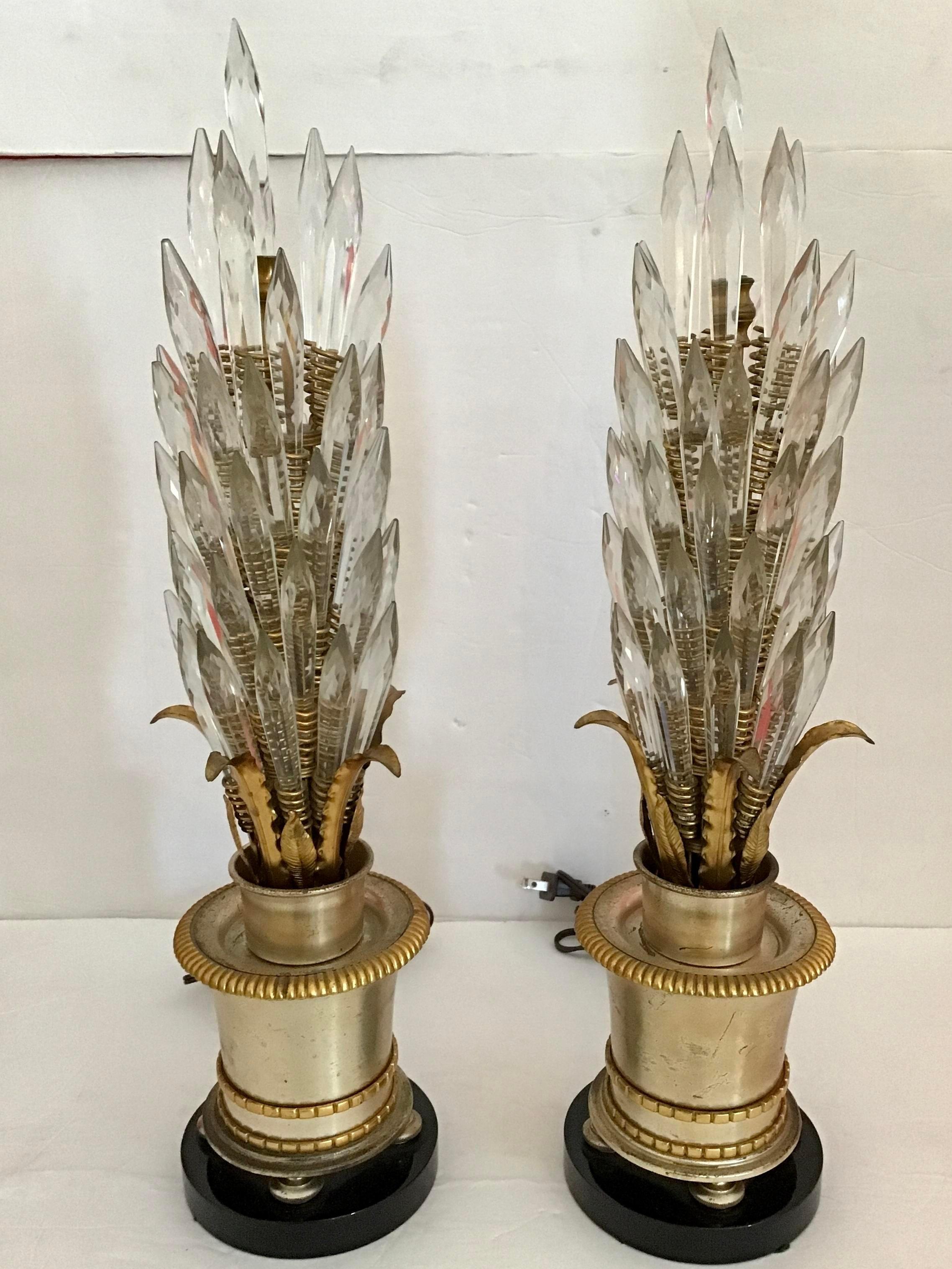 Very elegant pair of Jansen table lamps with crystals adorning like a corn with gilt leaves. Base is metal bronze on small legs. Great details in their design. Would be a nice addition to your interiors, would look great in a studio or library.