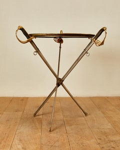 Jansen, Guéridon avec sabres, laiton et poaline noire, vers 1960, France.