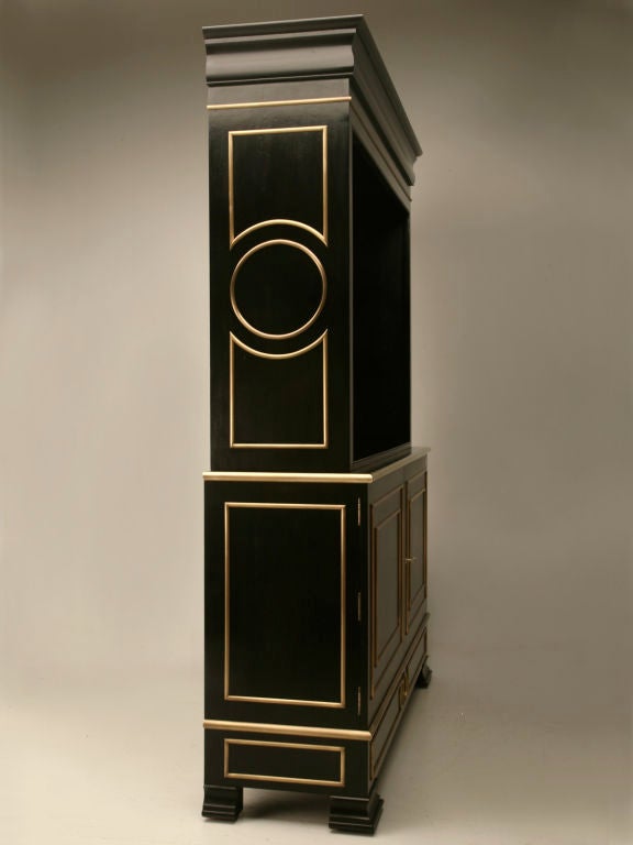 Jansen inspired ebonized mahogany bookcase or bibliotheque with solid bronze trim. Available in your exactly specifications and with or without doors. There are virtually no limitations with regards to size or finishes and we have even made some