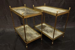 Jansen Neoclassical Brass Two-Tiered Side Tables with Églomisé Tops