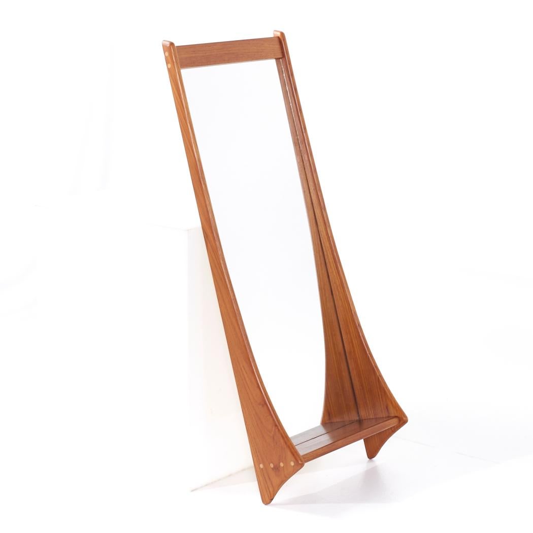 Jansen Spejle Mid Century Danish Teak Wall Hall Mirror with Shelf

This mirror measures: 17 wide x 5.75 deep x 43.5 inches high

All pieces of furniture can be had in what we call restored vintage condition. That means the piece is restored upon
