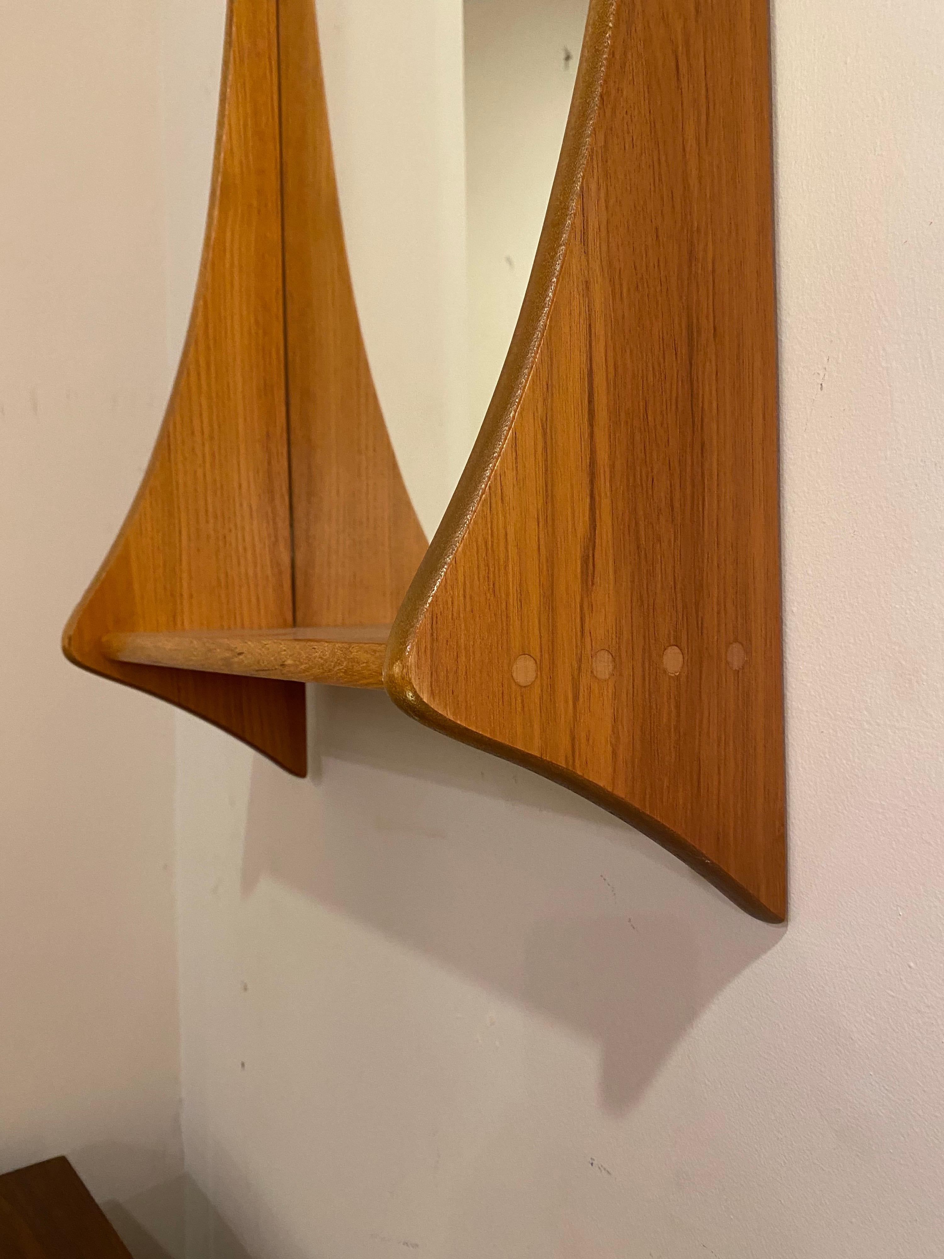 Jansen Spejle teak wall / shelf mirror. Perfect inside a entrance, great spot to throw the keys! Beautiful graceful curved sides with round lighter dowel joinery.