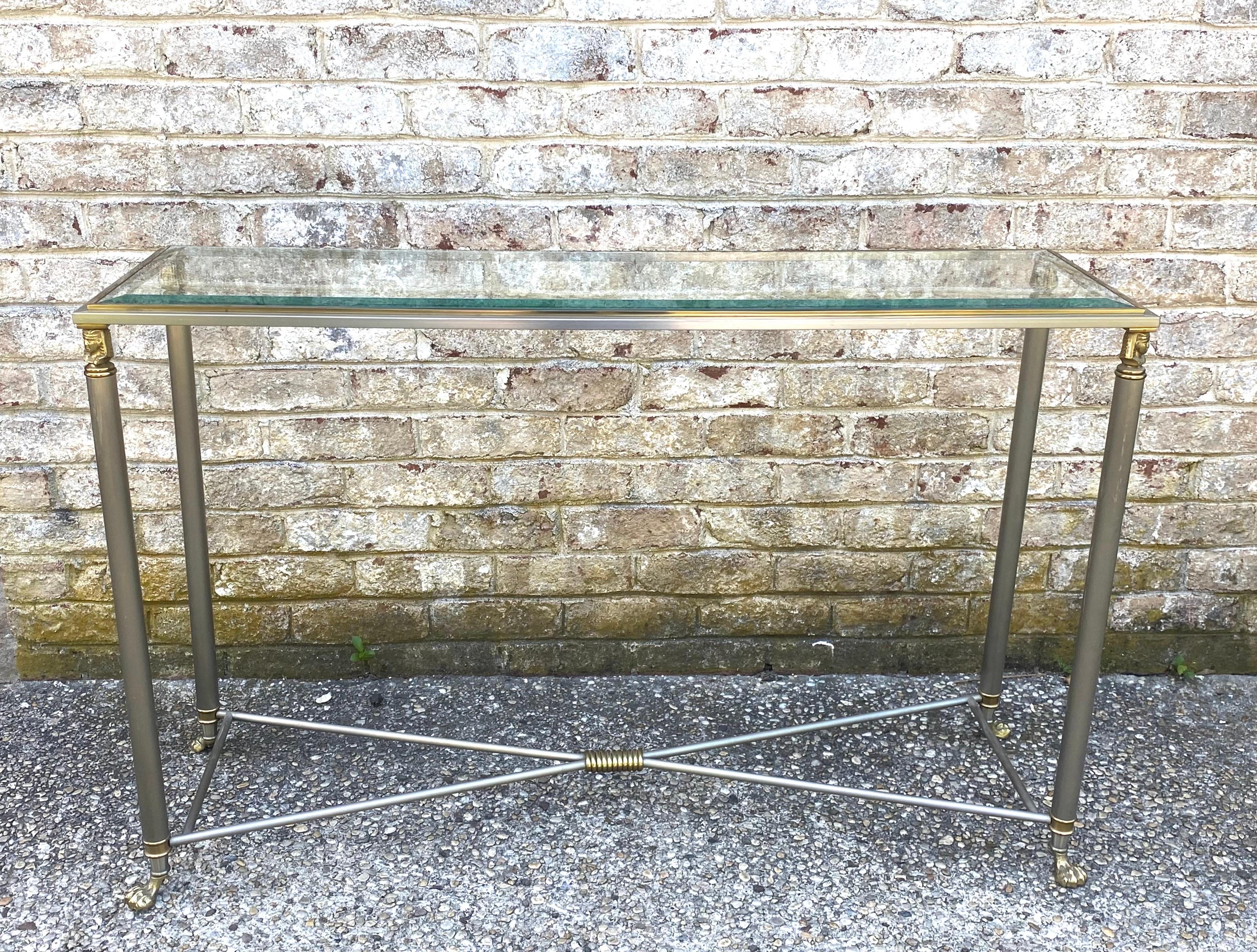 Jansen style console table with paw feet and Egyptian style brass mounts..... beveled glass inset top....