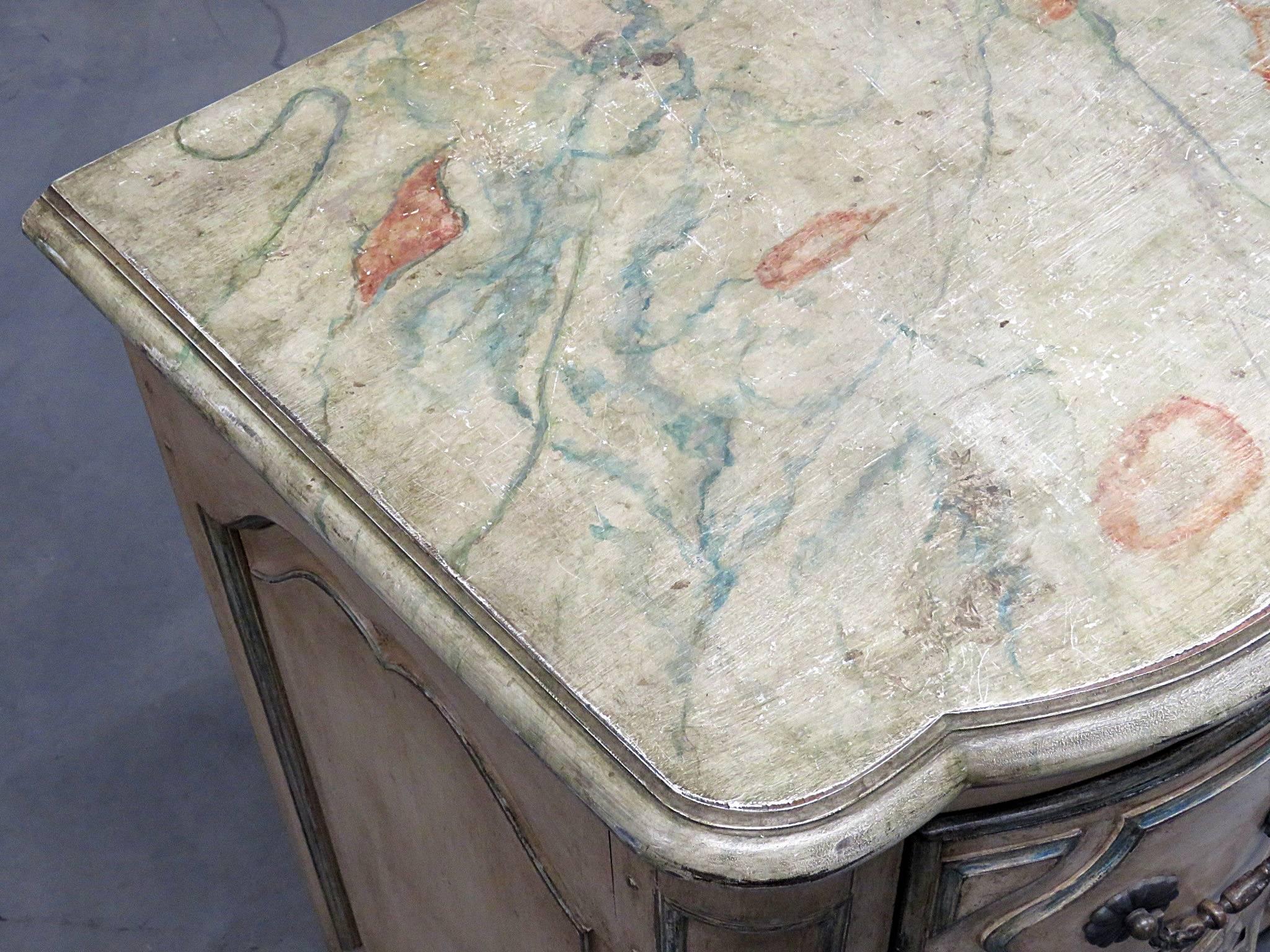 Jansen style distressed decorated three-drawer commode.