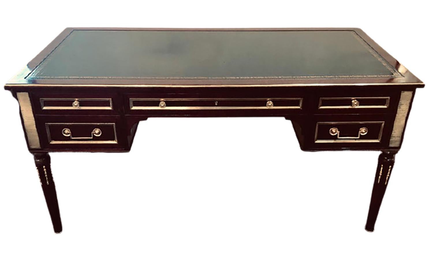 Jansen style fully refinished Louis XVI fashioned bronze-mounted desk. This fine custom quality desk has a wonderfully fully polished flame mahogany finish on tapering leg with bronze sabots and flame reeded legs supporting a large center bronze