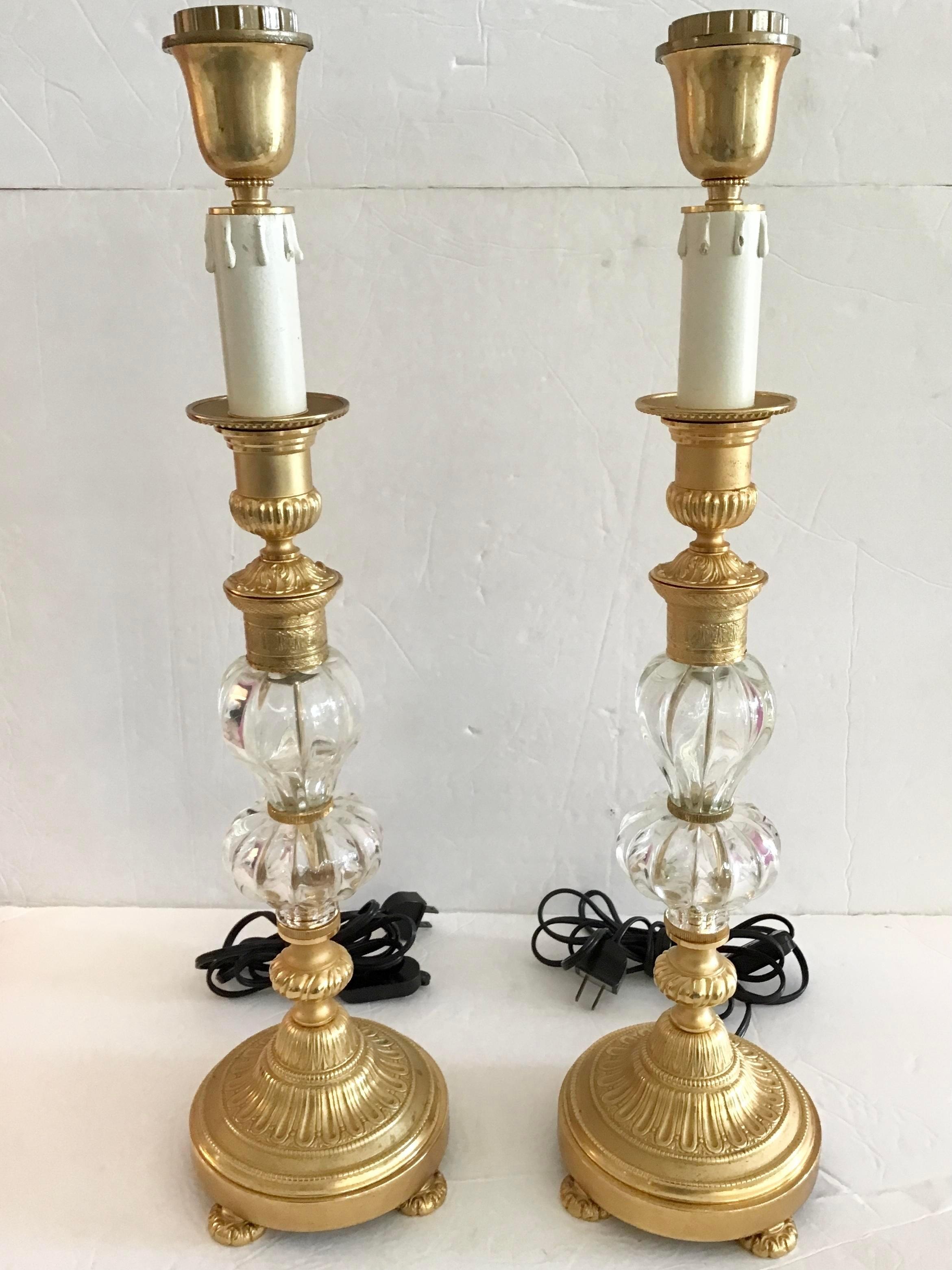 Fabulous pair of Jansen style table lamps with gilt bronze details and clear glass elements. Amazing bronze details with perfect gilt. Really beautiful quality workmanship and pair. Extremely rare to have a pair of this quality. Add some French