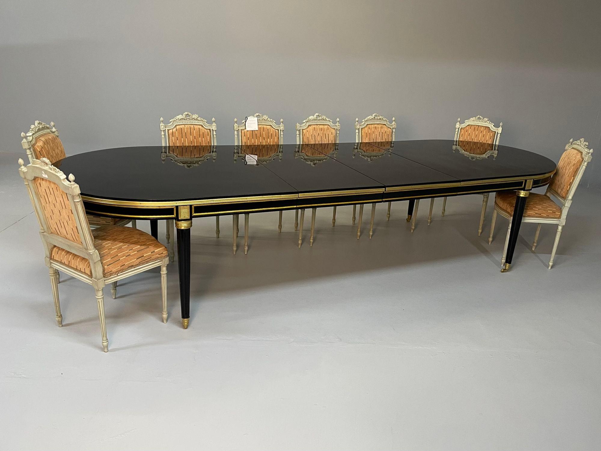 A Louis XVI Style Dining, Conference Table in the Fashion of Maison Jansen, Up to 15 feet fully extended

A Monumental ebony and bronze mounted dining table extending to 15 feet six inches long with all four 22 inch leaves inserted. Having four