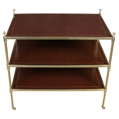 Jansen Style Three Tier Leather and Polished Brass Table on Casters