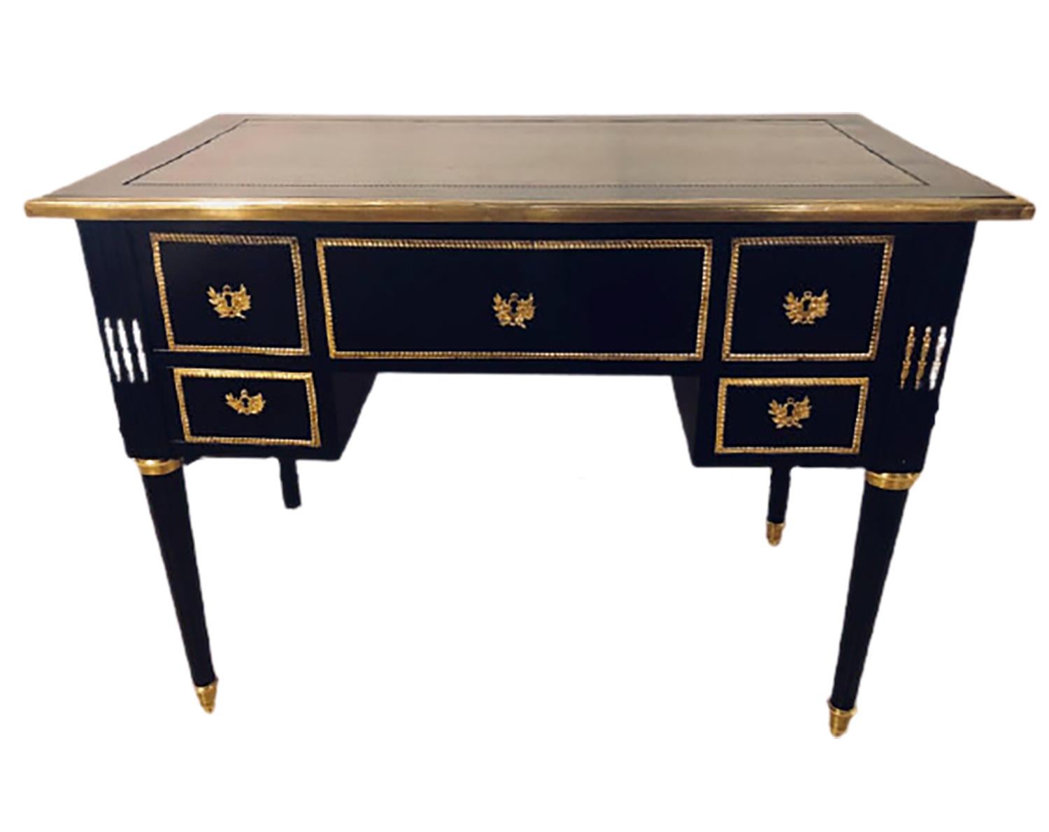 Hollywood Regency shines with this fine Jansen styled ebonized bronze mounted writing office desk or vanity having been fashioned in the Louis XVI style. This fine knee hole desk has a wonderful ebony finish that has been hand rubbed French