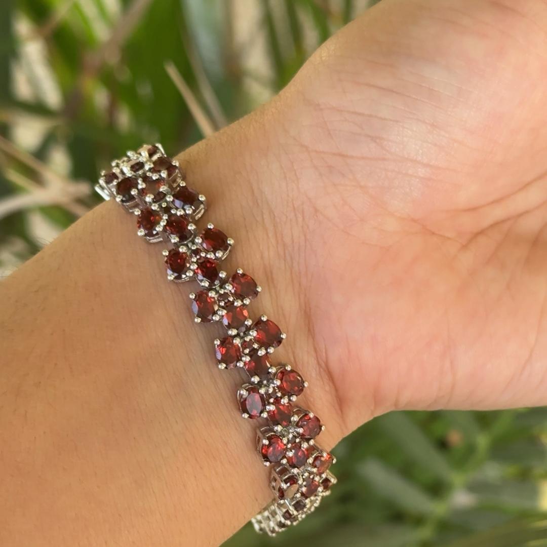 January Birthstone Natural Garnet Tennis Bracelet in sterling silver showcases endlessly sparkling natural Garnet, weighing 38.3 carat. It measures 7 inches long in length.
Garnet stimulate concentration and reduces stress. 
Designed with perfect