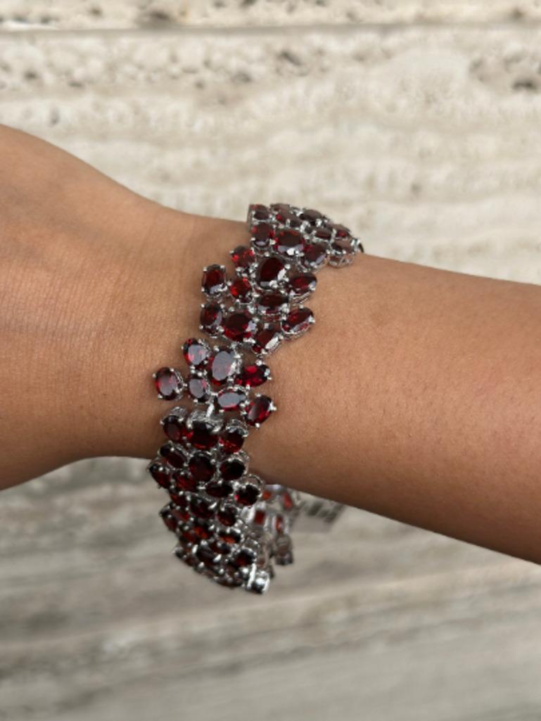 Beautifully handcrafted January Birthstone Garnet Wide Wedding Bracelet, designed with love, including handpicked luxury gemstones for each designer piece. Grab the spotlight with this exquisitely crafted piece. Inlaid with natural garnet gemstones,