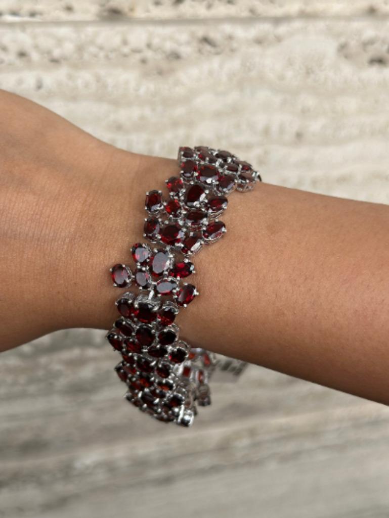 January Birthstone Garnet Wide Wedding Sterling Silver Bracelet for Women in sterling silver showcases endlessly sparkling natural garnet, weighing 59.4 carat. It measures 8 inches long in length.
Garnet stimulate concentration and reduces stress.