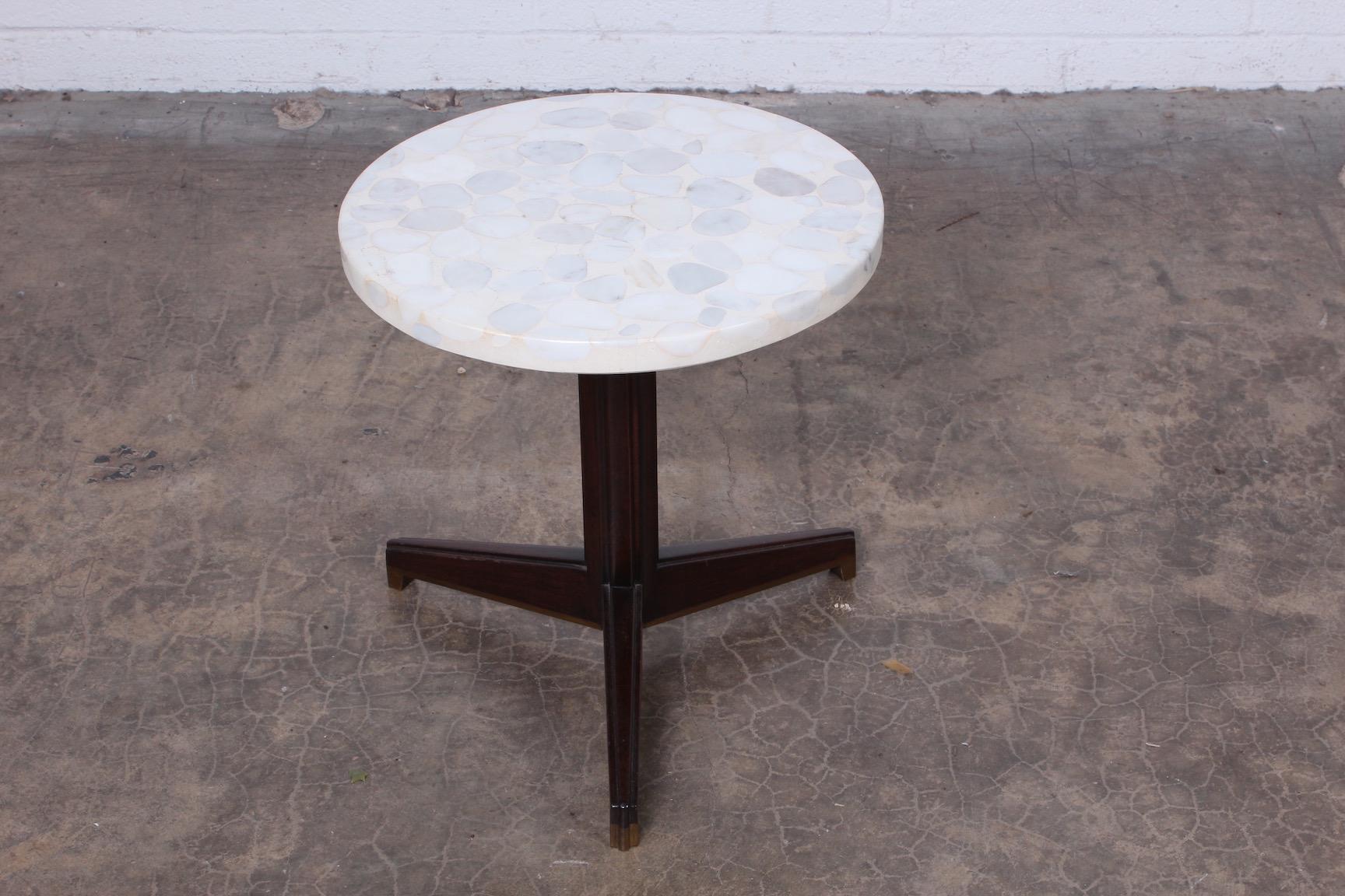 A stone top Janus side table with mahogany and brass base. Designed by Edward Wormley for Dunbar.