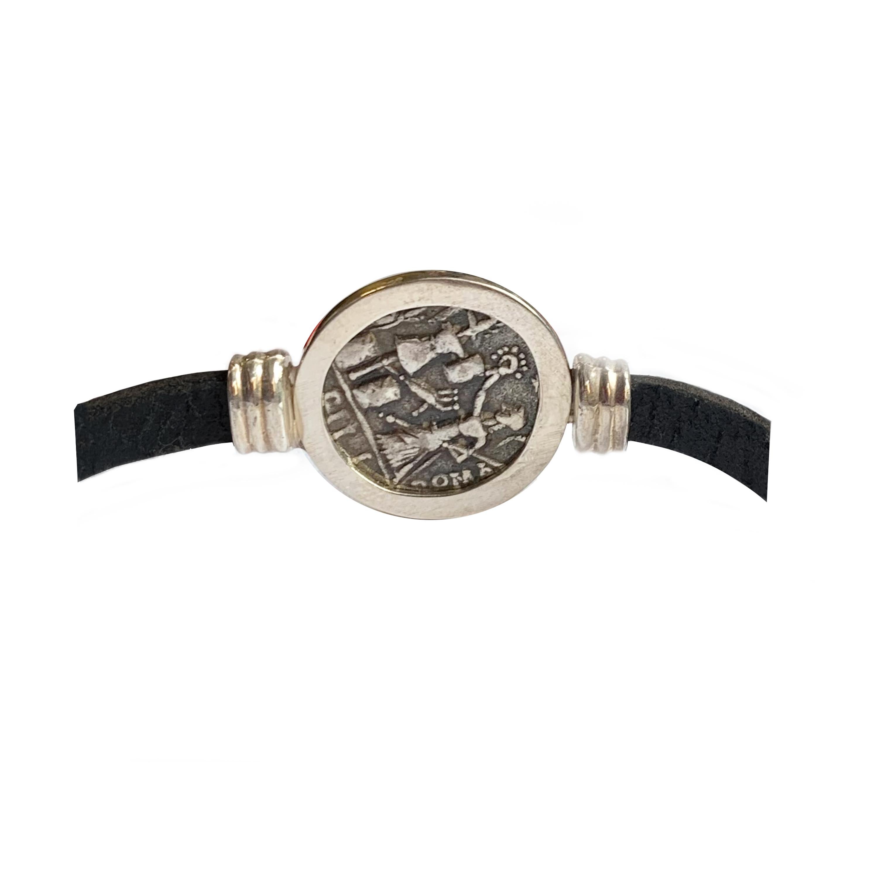 In this sterling silver and leather bracelet, an authentic Roman coin from the 2nd century BC has been set, depicting the two-faced God Janus.
In ancient Roman religion and myth, Janus pronounced is the god of beginnings, gates, transitions, time,