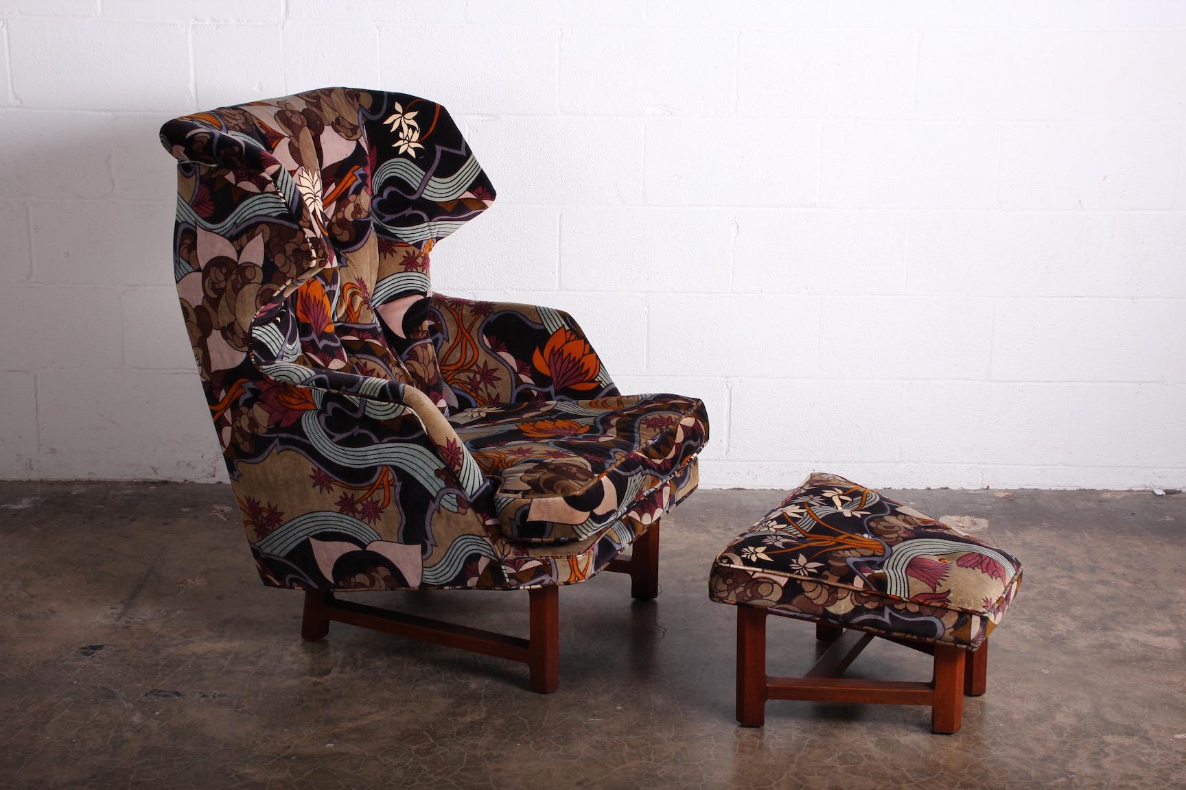 A Janus wing chair and ottoman designed by Edward Wormley for Dunbar in Jack Lenor Larsen Fabric.