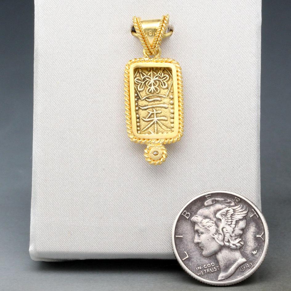 An interesting small rectangular gold coin from the last Japanese shogunate, minted in the waning days of their power 1837-1854, is set in a Steven Battelle designed handmade classic double braid 18K gold setting with 2 mm and 1.7 mm VS1 diamond