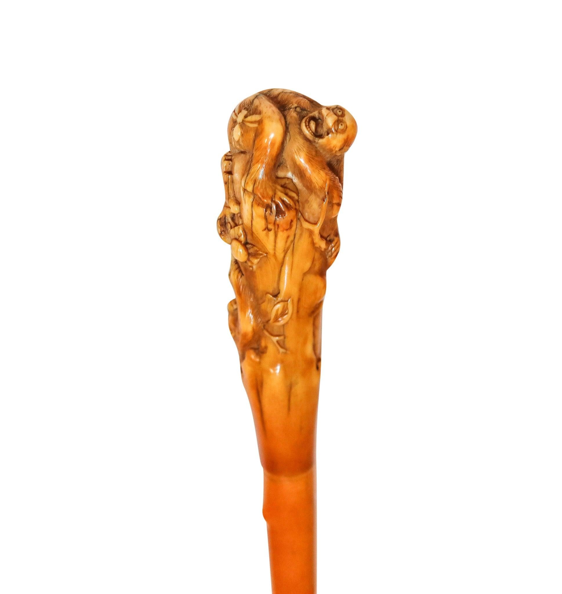 Waling cane from the Meiji Period (1868-1912).

This is a fabulous antique walking cane created in the imperial Japan during the Meiji period (1868-1912), circa 1880's. The cane was masterfully carved showing bamboo-trees patterns and two monkeys,