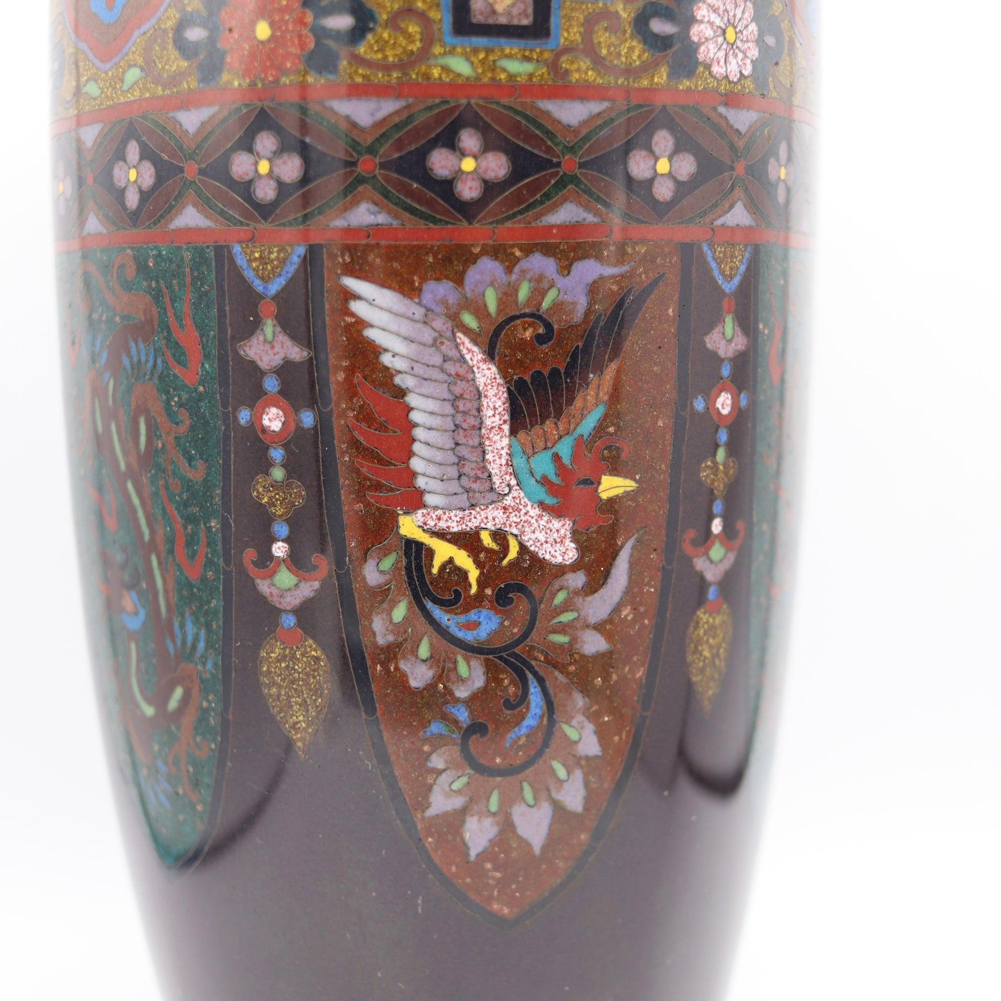 Japanese vase from the Meiji Period (1868-1912).

This is a beautiful antique decorative vase created in the imperial Japan during the Meiji period (1868-1912), circa 1890s. It was carefully crafted in solid bronze with copper wires and embellished