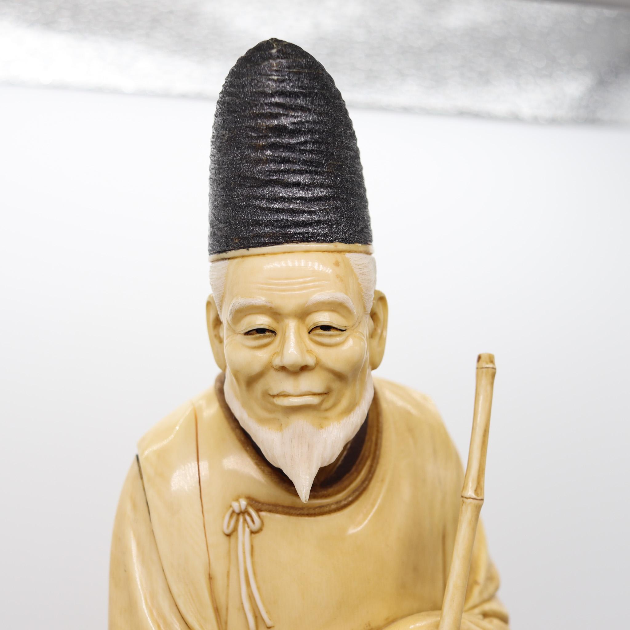 Hand-Carved Japan 1890 Meiji Carved Sculpture of a Dressed Monk With a Rake