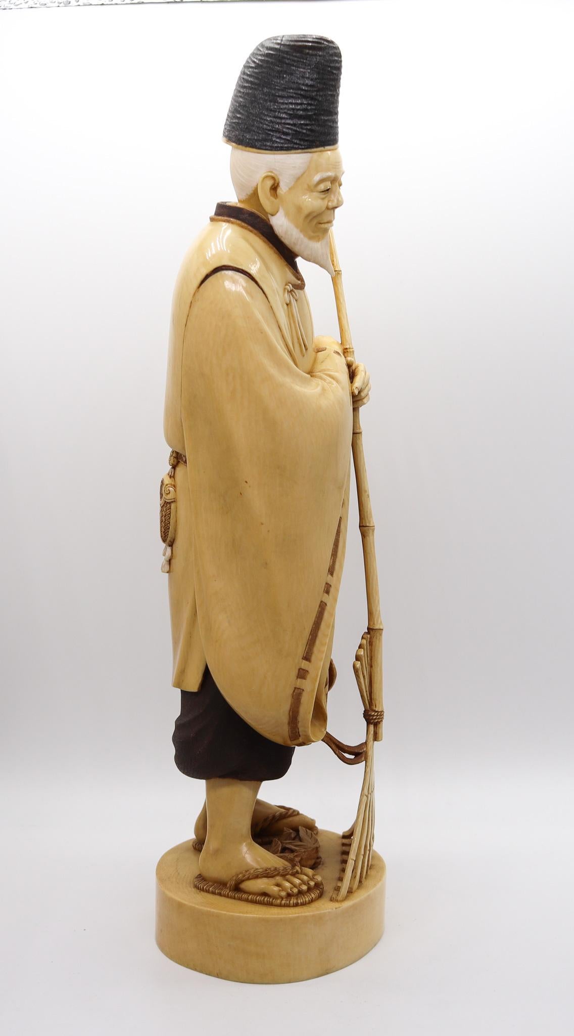 Ivory Japan 1890 Meiji Carved Sculpture of a Dressed Monk With a Rake