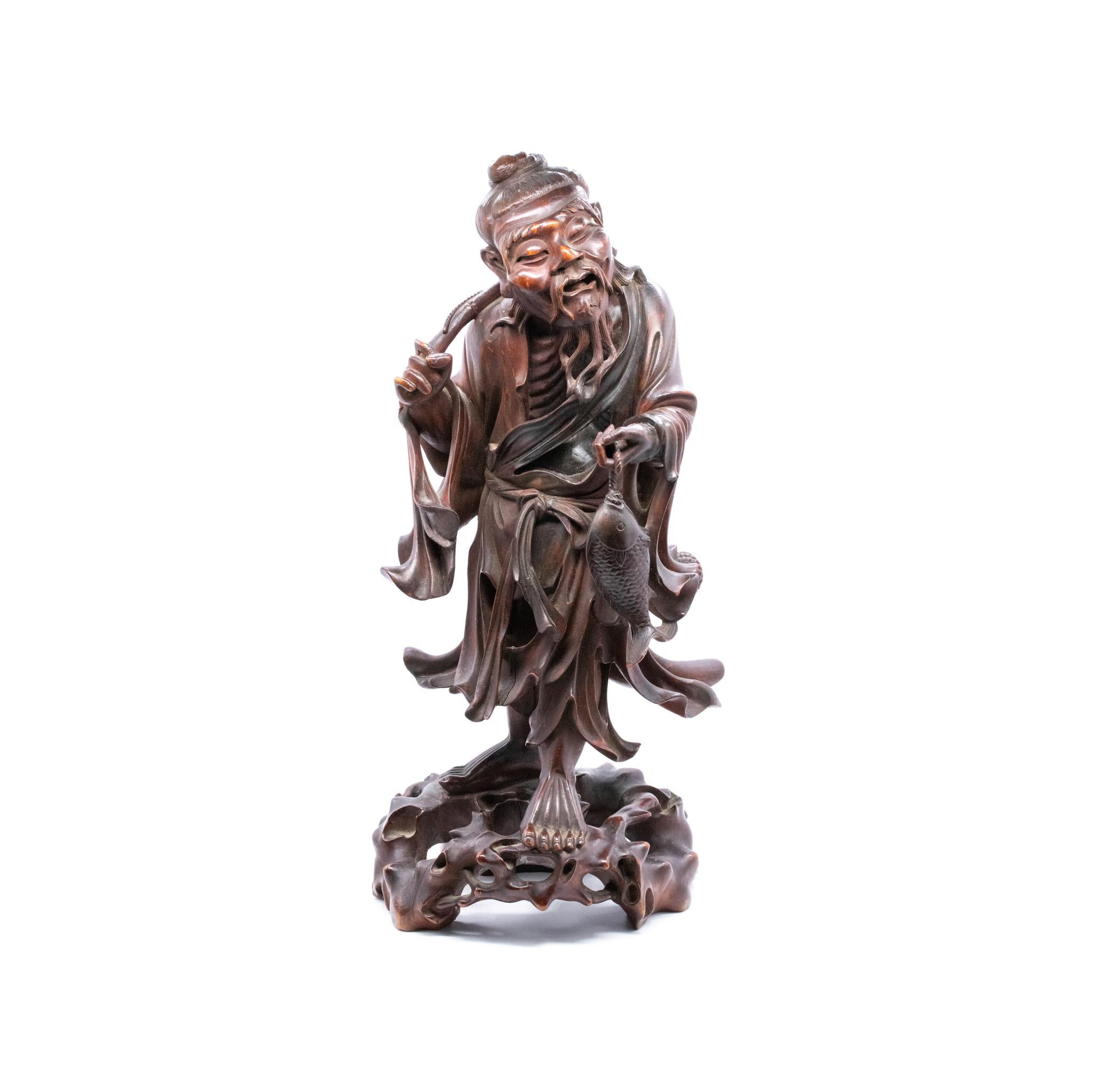 An extremely well detailed wood carving of Ebisu, as a fisherman.

Beautiful and well detailed sculpture, created in Japan during the Meiji dynastic period (1868-1912) back in the 1890's. This piece represent the god of good fortune Ebisu. Was