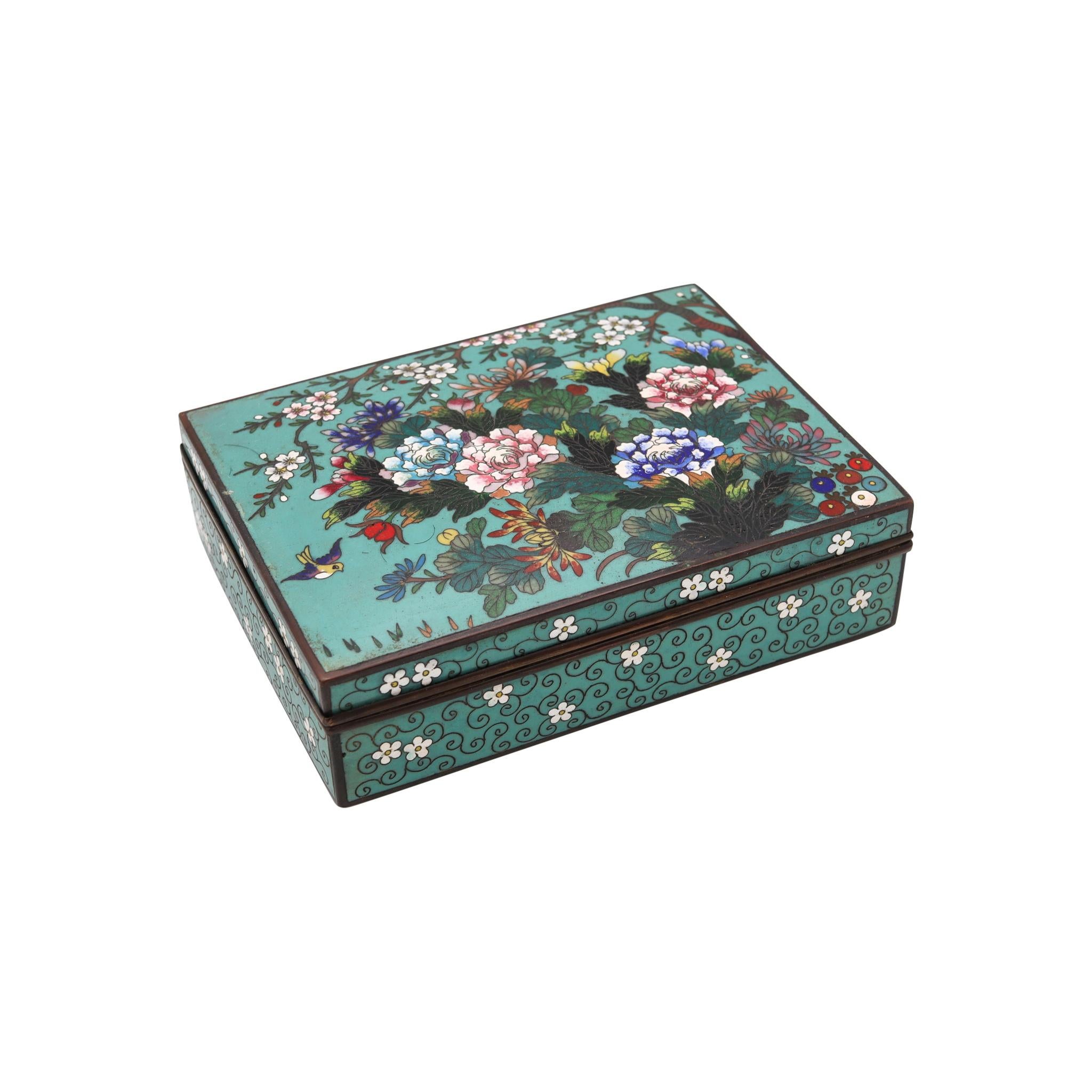 Japanese box from the Meiji Period (1868-1912).

Beautiful antique rectangular colorful box, created in Japan during the Meiji period (1868-1912), circa 1890's. It was carefully crafted in solid bronze with copper wires and embellished with