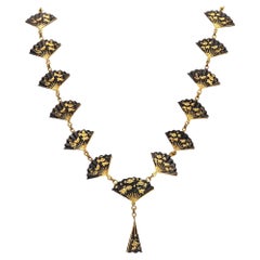 Collier Meiji Menuki japonais 1910 avec Shakudo en or 14 carats, or et bronze 24 carats