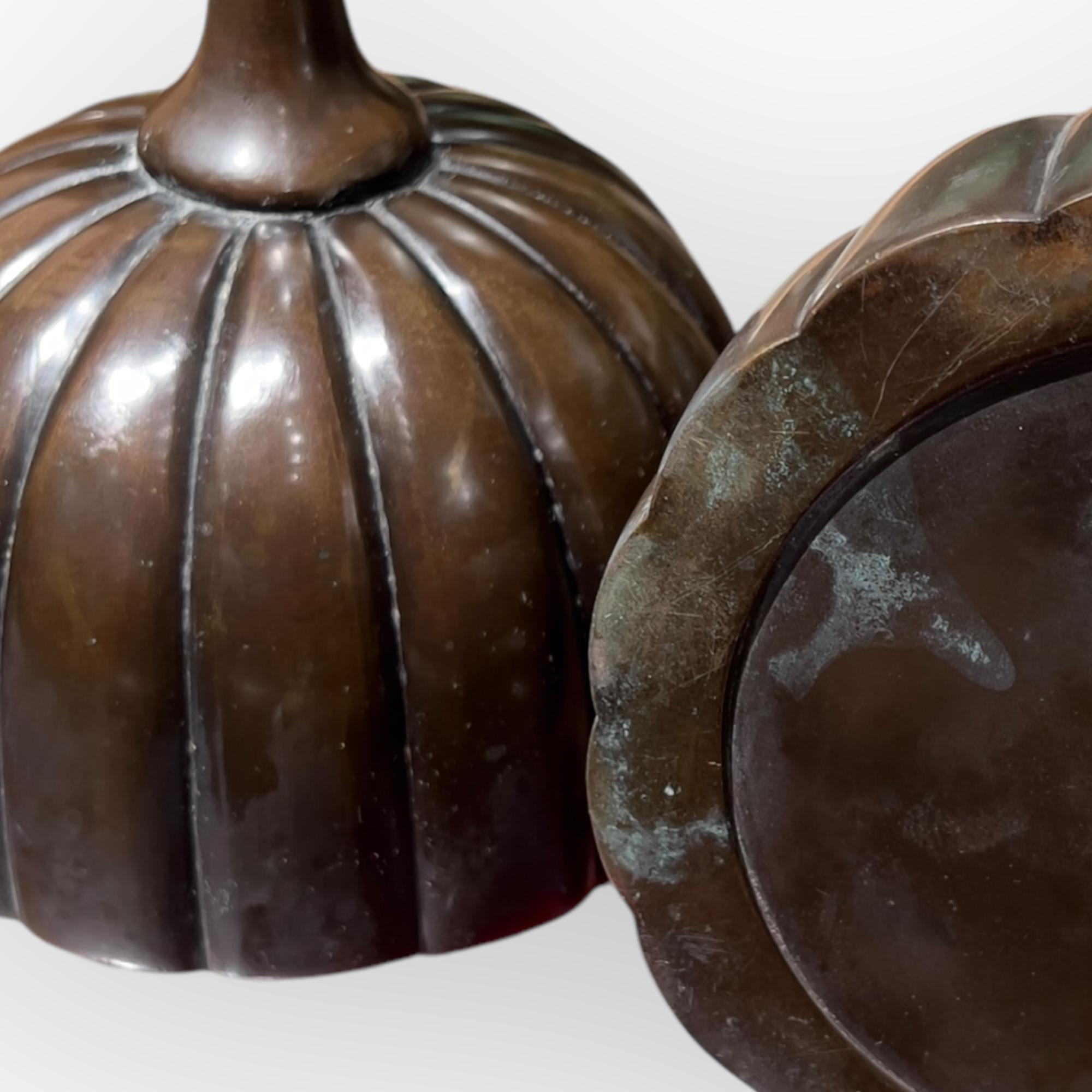 A large pair of Japanese Shokudai bronze candle holders. The base and the top part in the shape of a chrysanthemium flower. 
Nice original dark brown patina with few traces of use.
Original wood box.