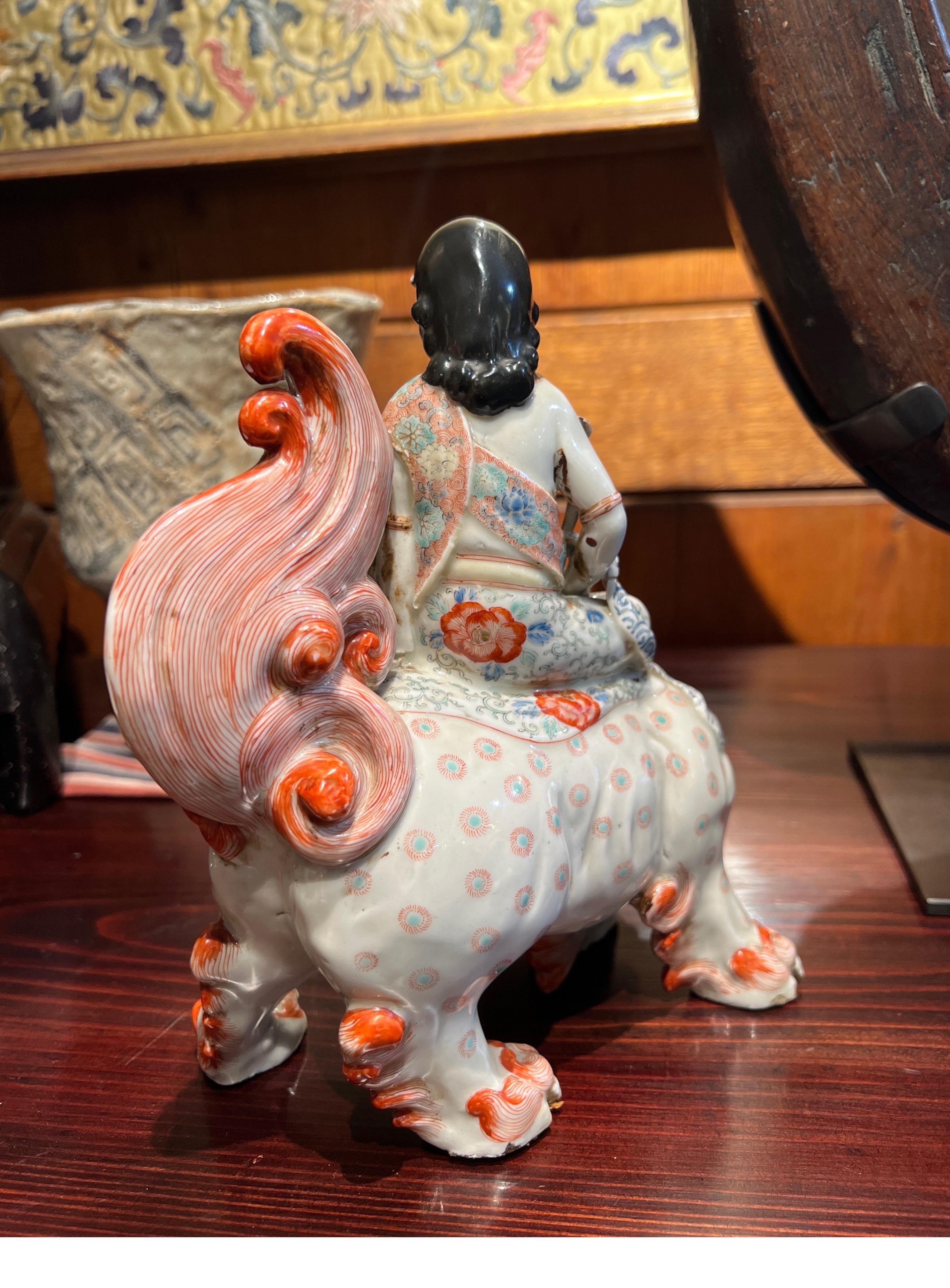 Porcelain Japan, A rare Japanese Kutani figure of Kannon on a Foo Lion, Meiji Period, 19th For Sale
