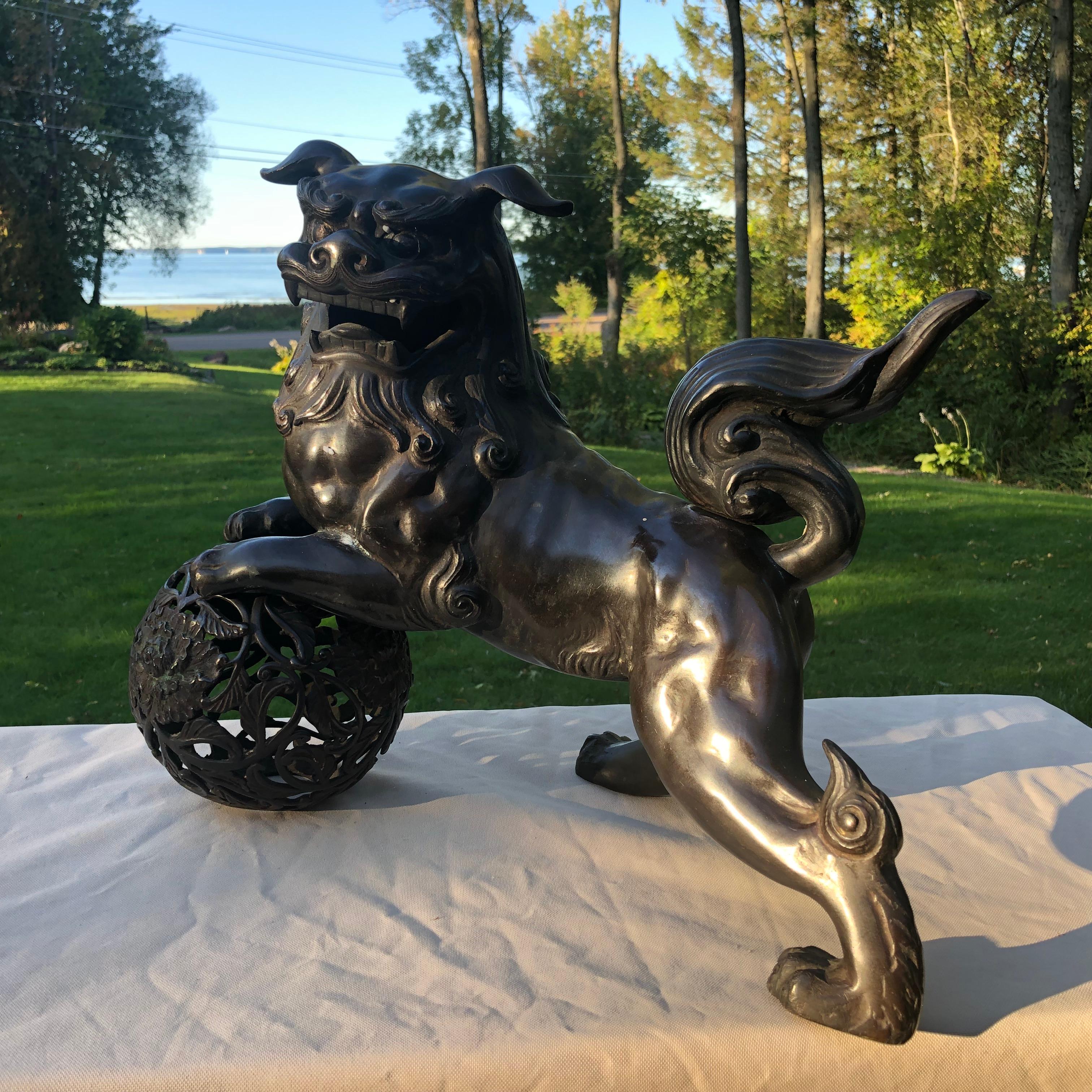 From our recent Japanese Acquistions Travels.

Handsome Sculpture Over 100 Years Old

Japanese fine one hundred plus year old cast bronze shishi koma-inu, two parts, signed on bottom, fine condition. 

Photographs taken indoors and outdoors in