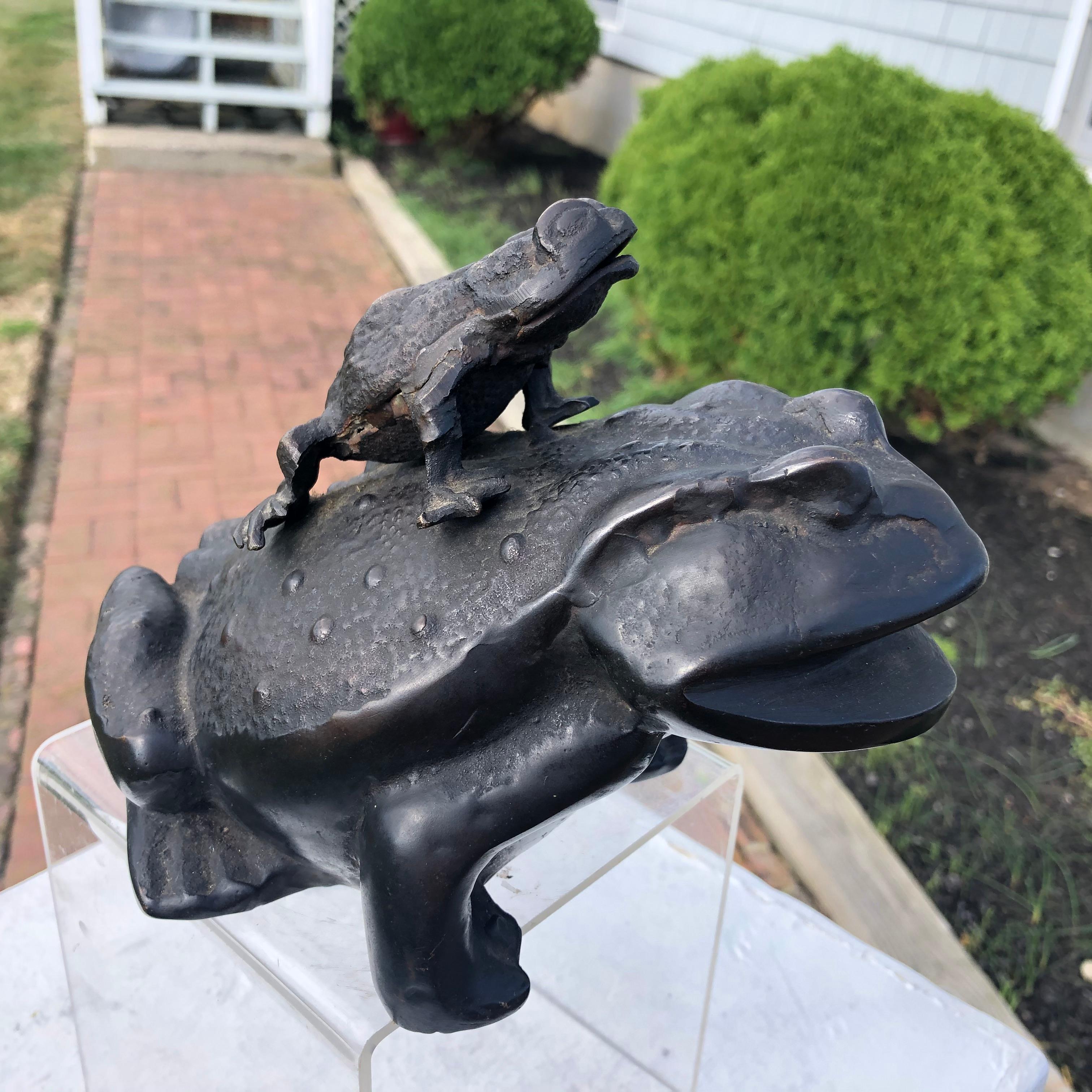 From our recent Japanese acquisitions

Japan, a hard to find hand cast cute bronze frog family -kaeru- sculpture dating to the Meiji period, 19th century.

Handsome youthful critter and bumps are cast on its piggy back and arms and with a