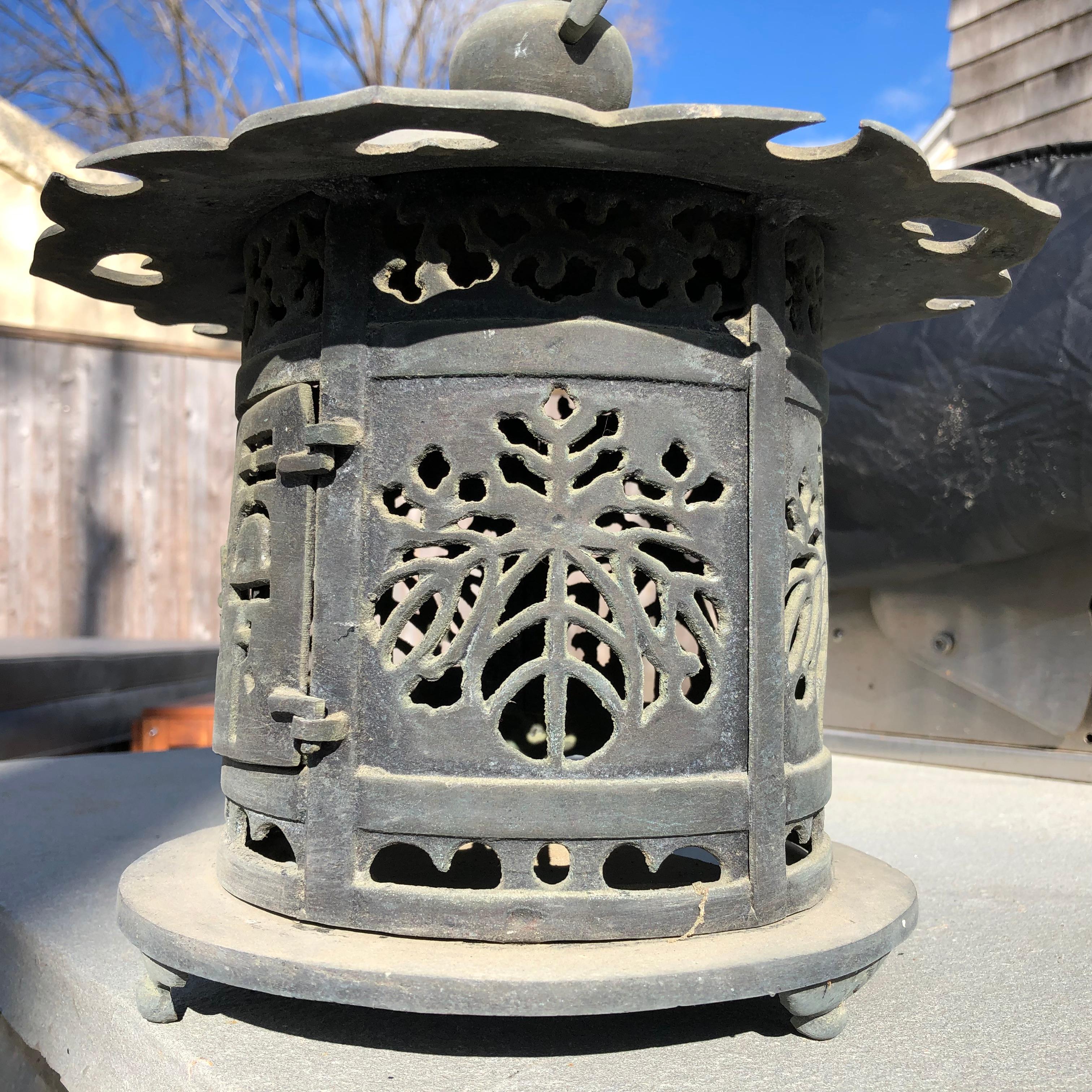 For your home, deck or favorite garden space - hang or place on its tripod feet

Japan, a fine large antique heavy and hand cast bronze lantern with exquisite details of flowers and hearts , and cast from the early Taisho period- one of the finest